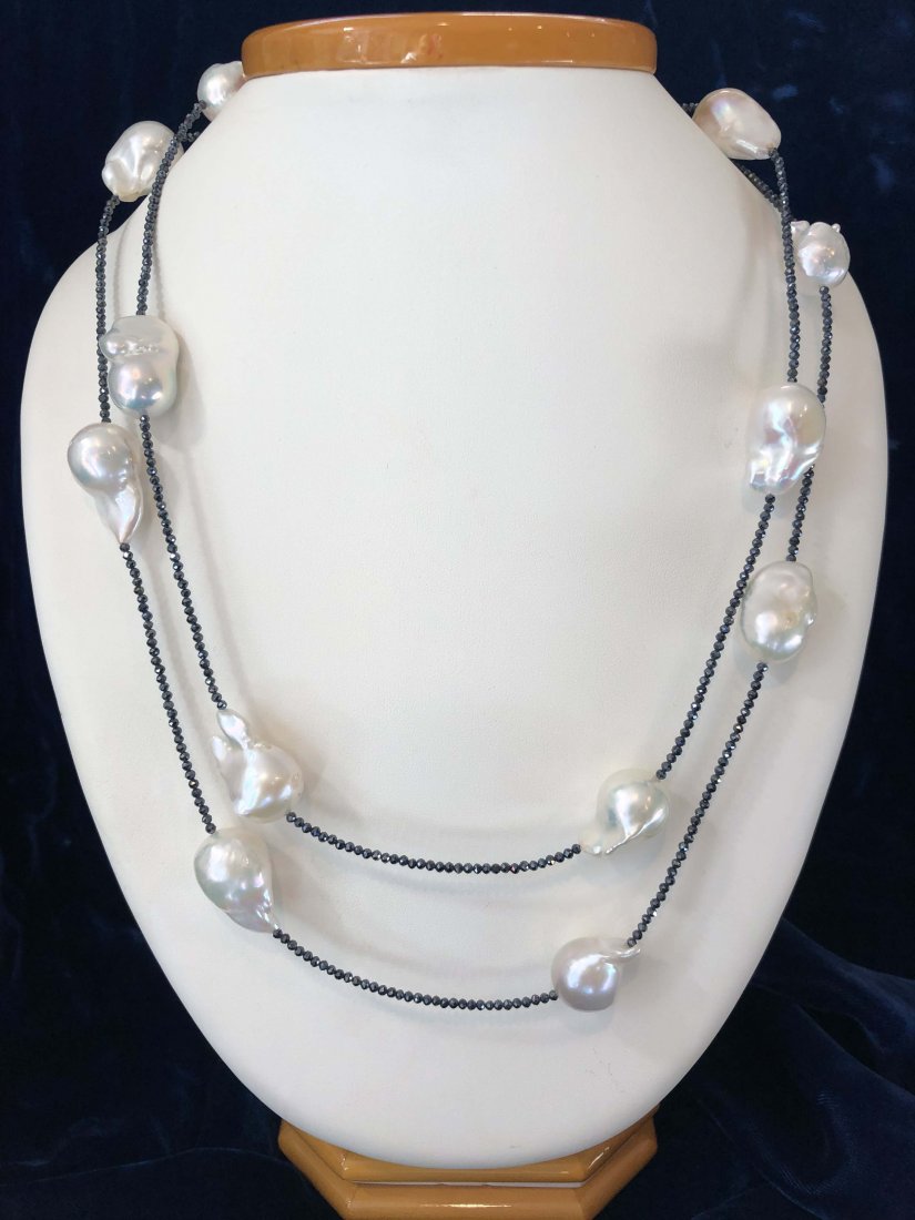 White Baroque Pearl and Spinel Necklace: 16mm x 25mm White Baroque Fresh Water Pearl Necklace on Spinel Strand, silver clasp Length 44 in.