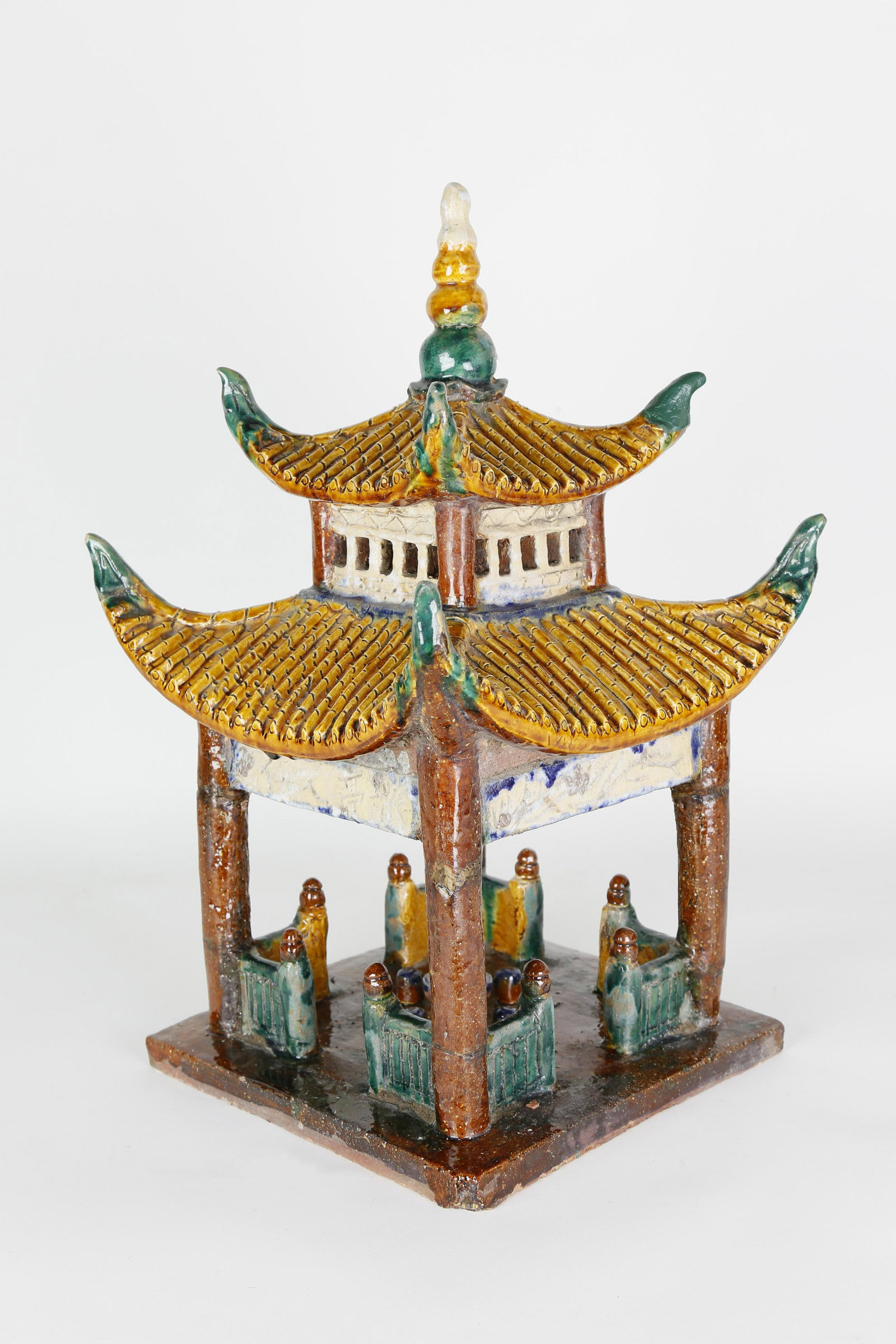Chinese Pagoda Roof Tile, 19th Century: Chinese Pagoda Roof Tile, 19th Century, underglazed green, yellow and brown with corner fencing and interior seating. Height 18 ½ in. Width 11 in. Depth 11 in.