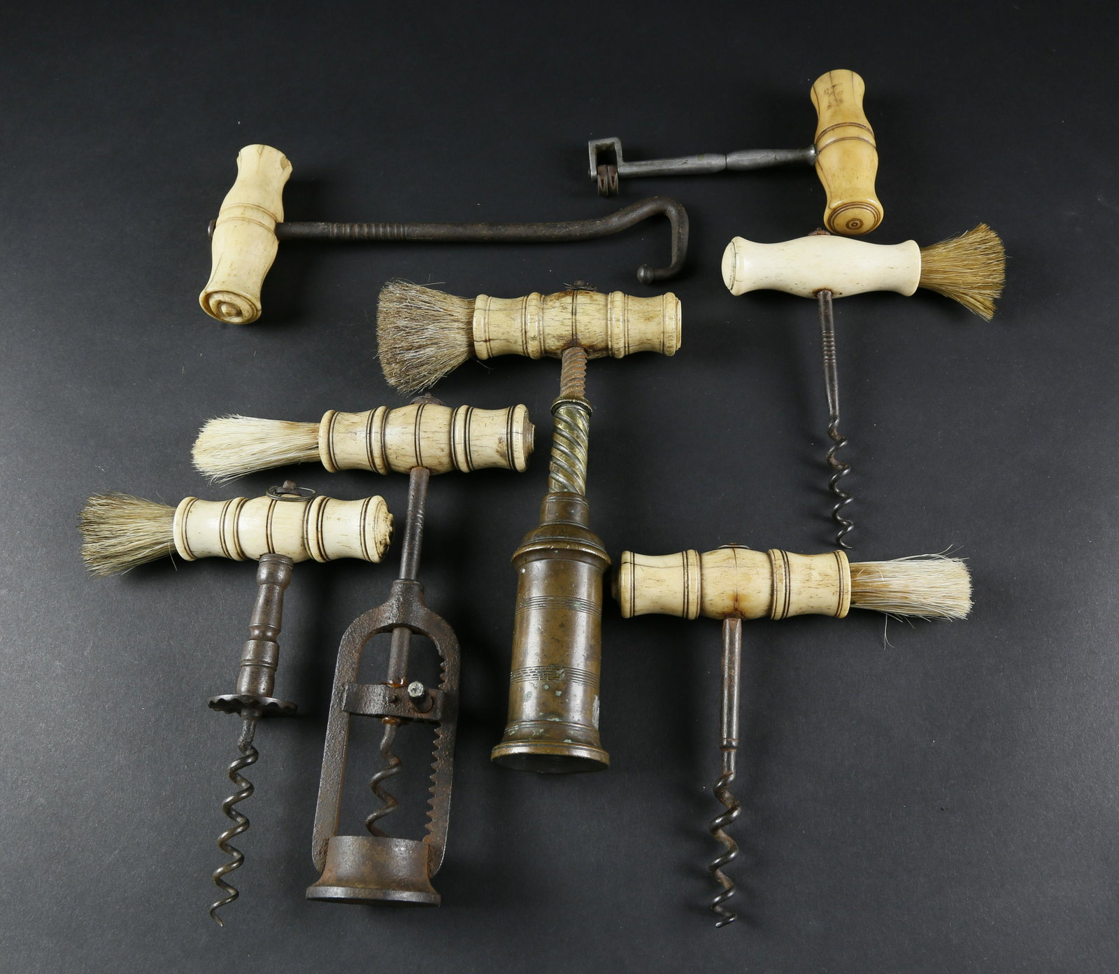 Collection of 7 Turned Bone Handled Utensils, mid 19th: Collection of 7 Turned Bone Handled Utensils, mid 19th Century, 5 corkscrews (2 with mechanisms), a boot pull and a tooth extractor.