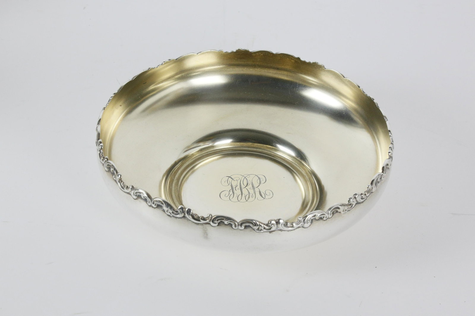 Sterling Silver Bowl with Gadrooned Scroll Decoration: Sterling Silver Bowl with Gadrooned Scroll Decoration, interior monogrammed, "FBR"stamped, "Sterling 3387, 925/1000 FINE, 2 Pints". Height 2 ¼ in. Diameter 8 in. Provenance:<