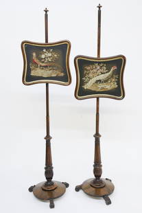 Pair of English Regency Pole Screens, circa 1840: Pair of English Regency Pole Screens, circa 1840, each screen with a needlepoint portrait of a male and female pheasant on a sliding and adjustable panel. Turned standard from a round rosewood base