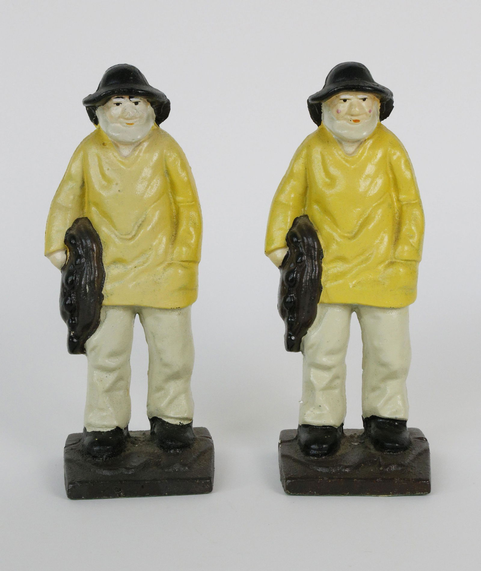 Pair of Contemporary Cast Iron Old Salt Doorstops: Pair of Contemporary Cast Iron Old Salt Doorstops Height 10.25 in. Dimensions Height 10.25 in. Origin 21st Century