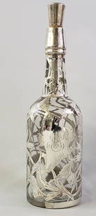 Sterling Silver Overlay Decanter: Sterling Silver Overlay Decanter, monogrammed initials, "L.E.G.", with thistle decoration. Height 12.25 in. Provenance: Estate of Linda Loring, 4 Rays Court, Nantucket Dimensions Height 12.25 in.