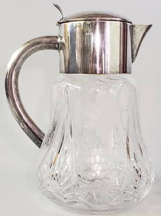 Antique Cut Crystal and Silver Plated Water Pitcher: Antique Cut Crystal and Silver Plated Water Pitcher, with interior chiller, floral and grape decoration. Maker's mark stamped underneath top portion of handle. Height 10.5 in. Width 8 in. Depth 6.5
