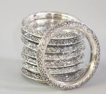 Set of 7 Sterling Silver and Crystal Coasters: Set of 7 Sterling Silver and Crystal Coasters, floral gadrooned decorated edge. (8 are pictured) Diameter 4 in. Provenance: Estate of Linda Loring, 4 Rays Court, Nantucket