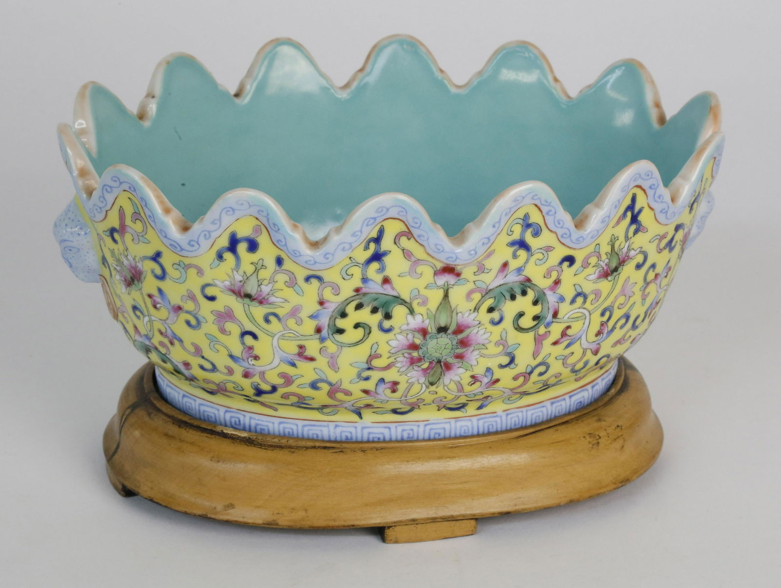 Chinese Famille Rose Fluted Rim Oval Bowl, 19th Century: Chinese Famille Rose Fluted Rim Oval Bowl, 19th Century, on custom wood base; the interior a glazed turquoise and the outer floral decorations on yellow ground, stamped China upon the base Height of B