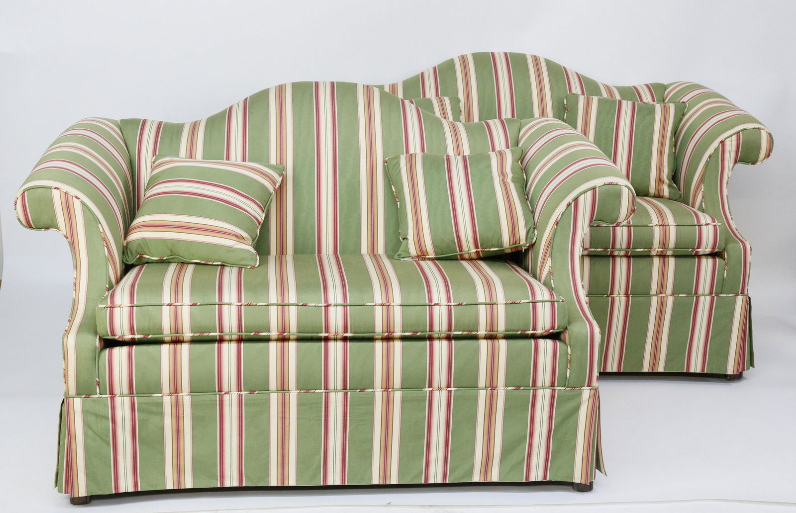 Pair of Candy Striped Upholstered Camelback Settees: Pair of Candy Striped Upholstered Camelback Settees, single cushion seats, each with two matching throw pillows Height 34 in. Length 58 in. Depth 33 in. Dimensions: Height 34 in. Length 58 in. Depth 3