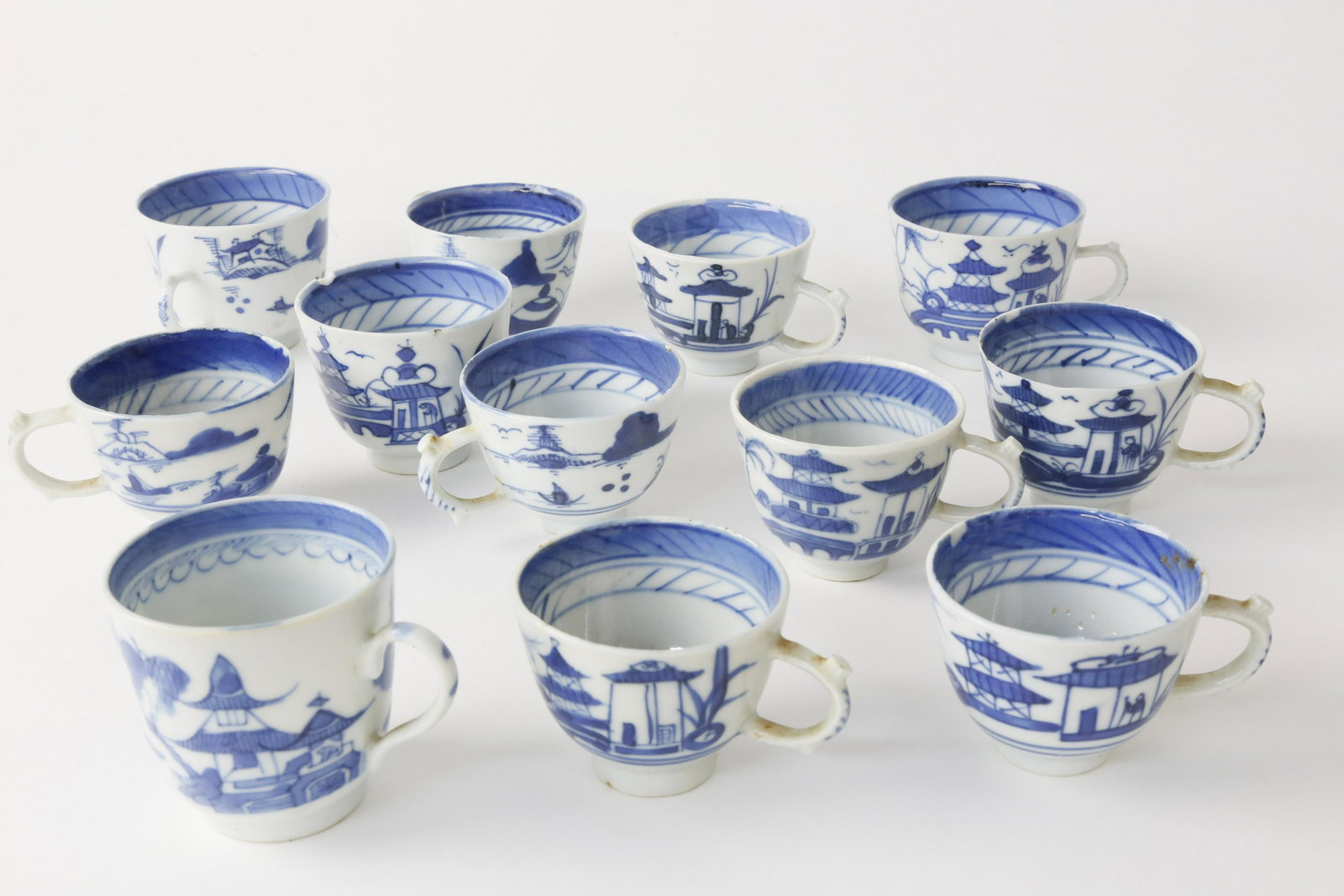 Assembled Set of 12 Canton Demitasse Cups, circa 1860: Assembled Set of 12 Canton Porcelain Blue and White Demitasse Cups, circa 1860 Circa: 19th Century