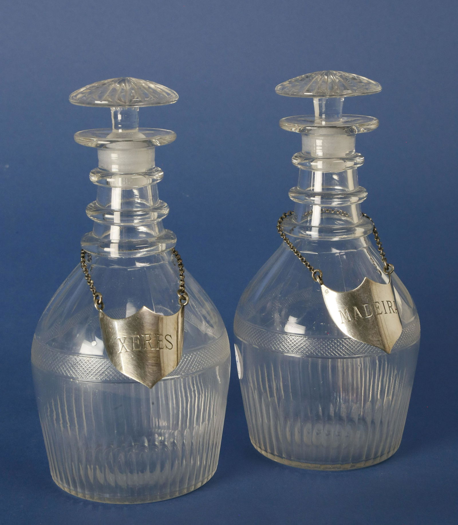 Pair of Blown Crystal Decanters, circa 1840: Pair of Blown Crystal Decanters, circa 1840, each with Christofle silver tags, "Madeira" and "Xeres" Height 8 in. Diameter 3.75 in. Dimensions: Height 8 in. Diameter 3.75 in. Circa: