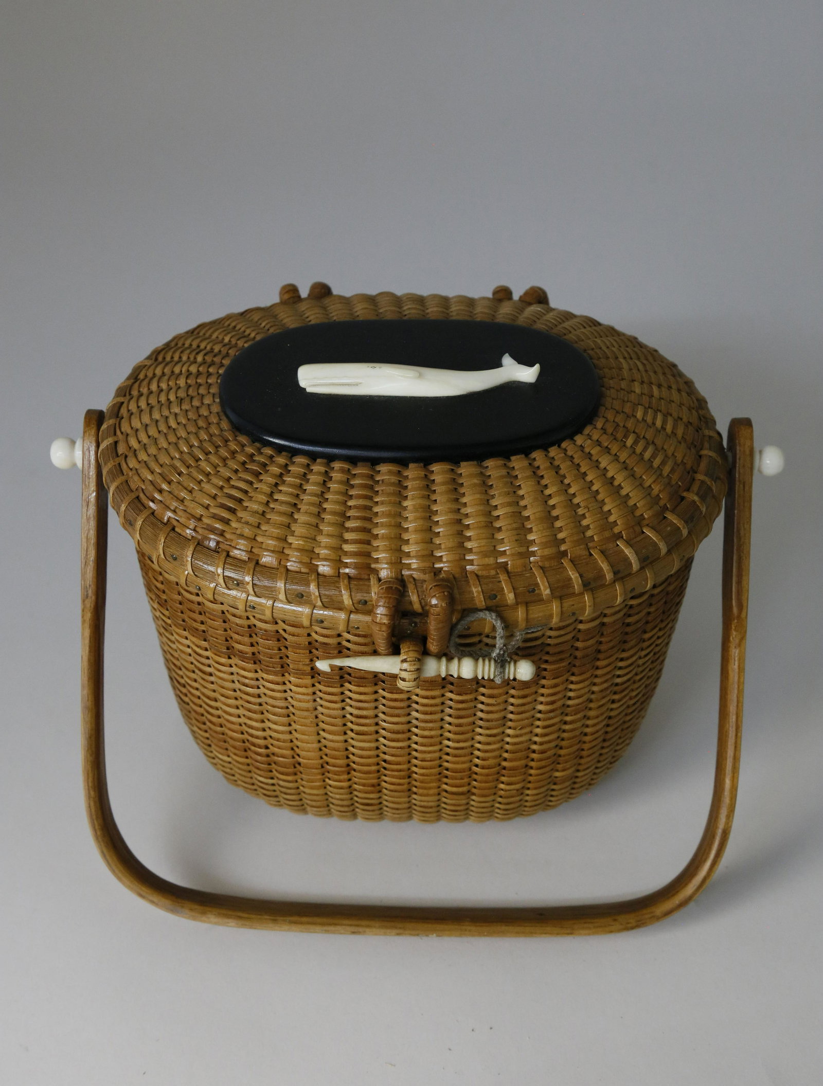 Sherwin Boyer Oval Nantucket Friendship Basket with: Sherwin Boyer (1907-1964) Oval Nantucket Friendship Basket with Carved Charlie Sayle Whale on Ebony Lid, with a 19th century bodkin pin, branded upon the base "BOYER" with original poem "I was made on