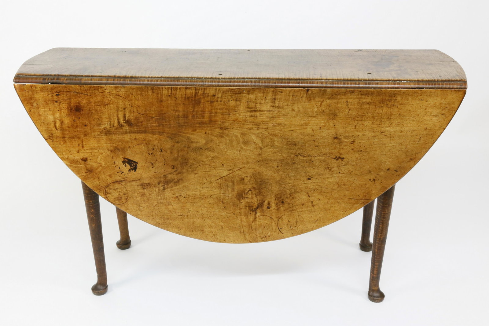 American Tiger Maple Queen Anne Drop Leaf Dining Table: American Tiger Maple Queen Anne Drop Leaf Dining Table, circa 1760, supported on block and turned tapering straight legs on pad feet. Height 26 ½ in. Open 47 ½ in. x 47 in. Closed 13 in.