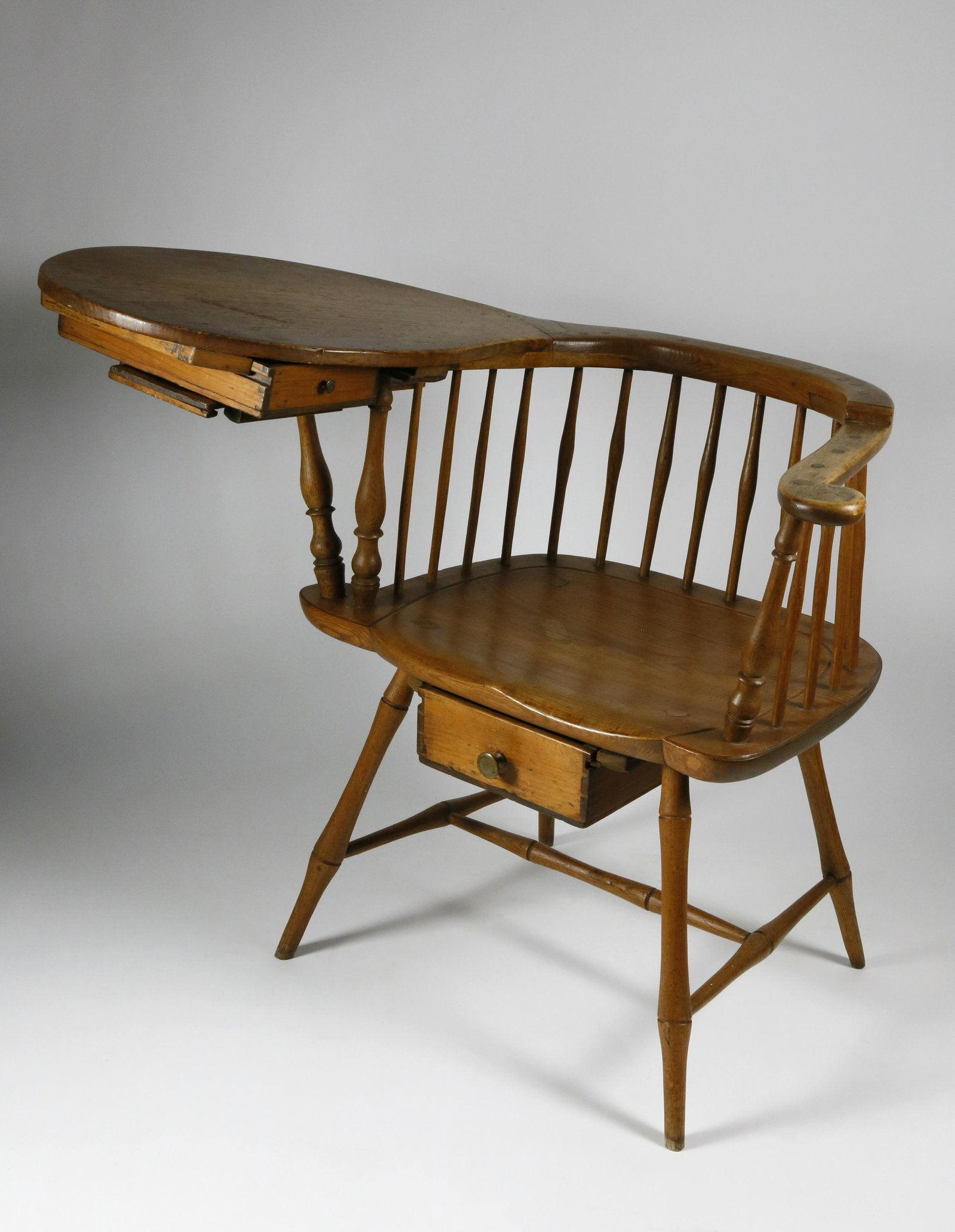 Scarce American Country Windsor Writing Armchair: Scarce American Country Windsor Writing Armchair, circa 1805-1810, two drawers and a candle slide, bamboo turned legs and stretchers. Height 30 in. Seat Height 17 in. Provenance: Guy Bush to the Prese