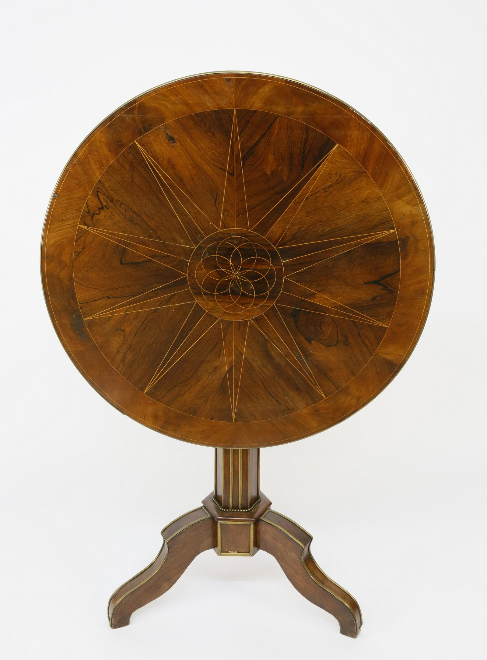 Charles X Mahogany and Rosewood Pedestal Table: Charles X Brass-Mounted Mahogany and Rosewood Pedestal Table, 1st quarter of the 19th Century, circular top inlaid with ten-pointed star tilts above hexagonal standard on tripod base. Height 30 &frac3