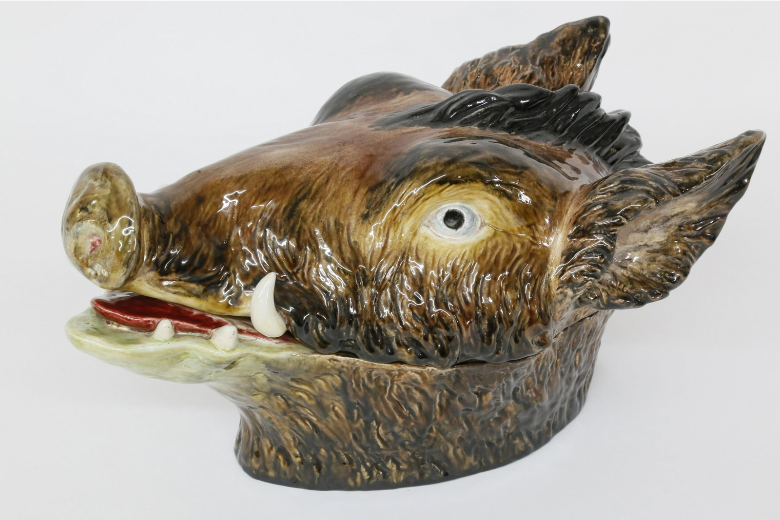 Portuguese Majolica Boar's Head Tureen, circa 1900: Portuguese Majolica Boar's Head Tureen, circa 1900, sculptural tureen and cover modelled in earthenware with majolica glaze; probably inspired by a Minton & Co. example of the 1870s. Apparently unmark