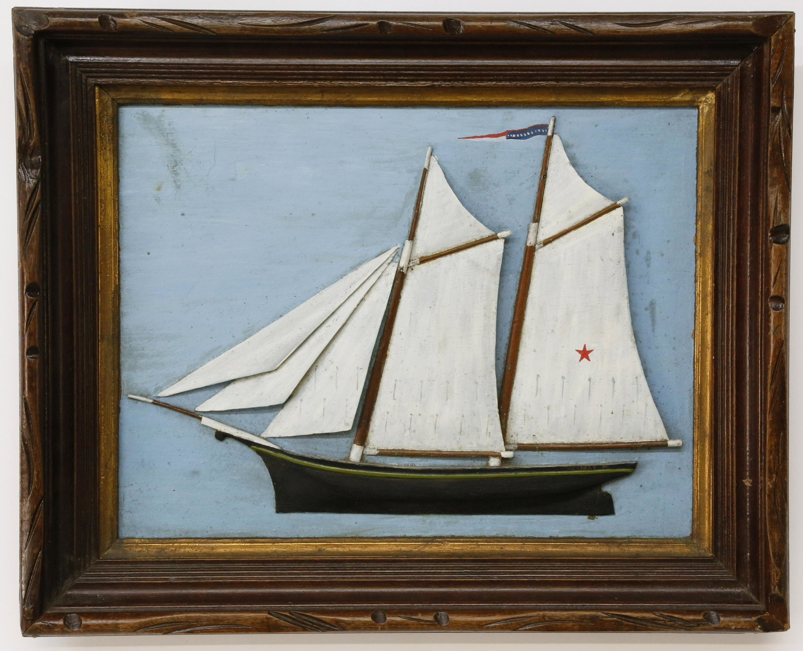 Carved & Painted Half Hull Diorama of the Schooner May: Carved and Painted Half Hull Diorama of the Two Masted Schooner "May", circa 1860, at full sail flying American "Coming Home" pennant from her mast. Carved from a single piece of wood housed in origin