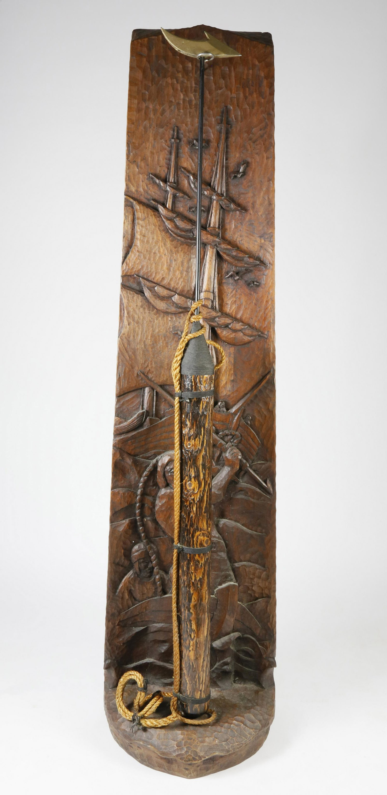 Val Robbins Relief Carved Display "Whale's Eye View": Val Robbins Relief Carved Black Walnut Display Stand, titled "Whales Eye View", the carving depicts a scene of a whaleboat, harpooner and whaleship looming in the distance. Impressed signature on reve
