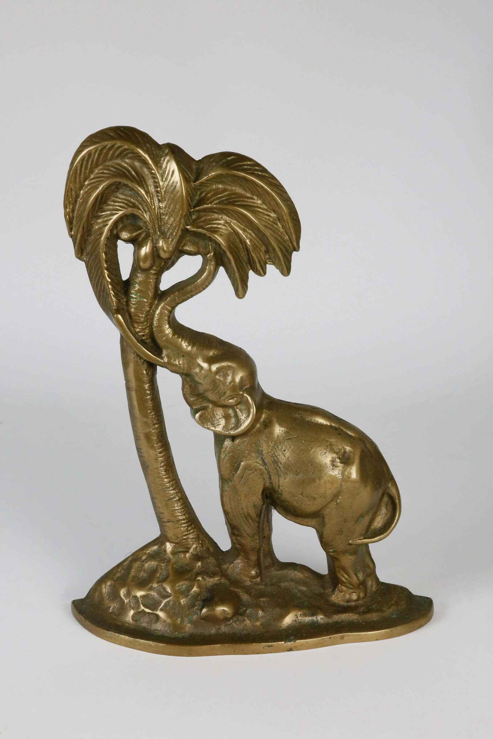 Vintage Gilt Patina Cast Iron Elephant Under a Palm: Vintage Gilt Patina Cast Iron Elephant Under a Palm Tree Doorstop Height 13.5 in.