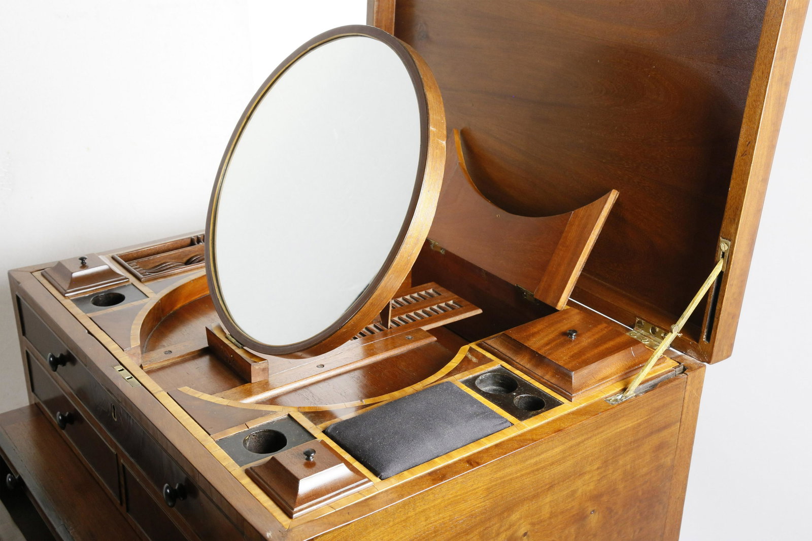 George III Mahogany Beau Brummell, early 19th Century: George III Mahogany Beau Brummell, early 19th Century, crossbanded in figured satinwood, the rectangular case opens on locking hinges to disclose a lavishly appointed interior of lidded wells, compart