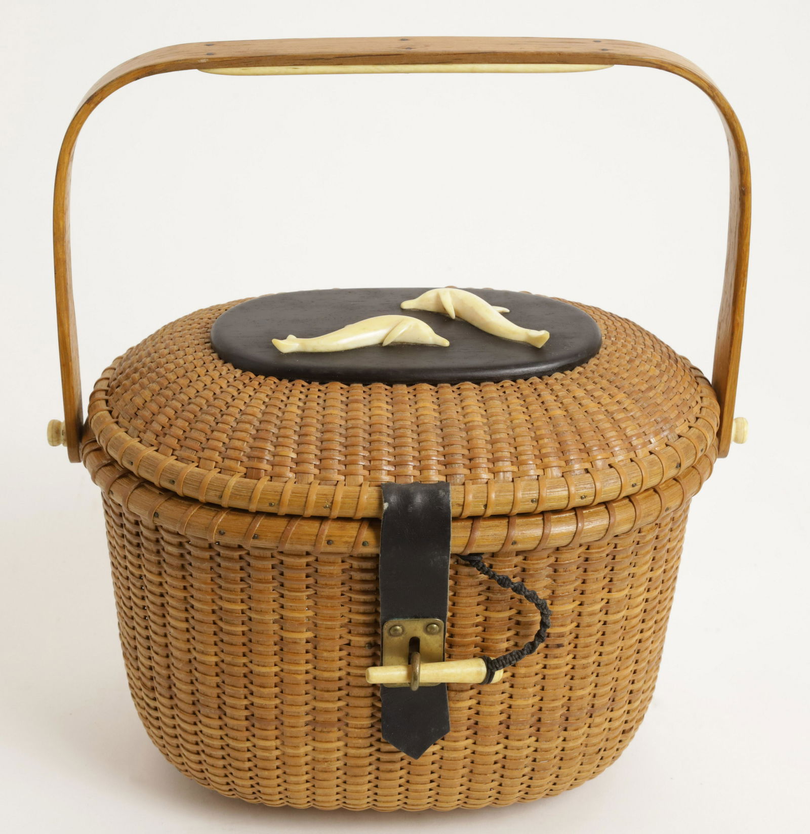 Stanley Roop Nantucket Friendship Basket: Stanley Roop Nantucket Friendship Basket, with oval ebony top with pair of carved dolphins, unique leather hinges and clasp closure, signed upon the base "Stanley M. Roop, 1966, Nantucket, Mass" Heigh
