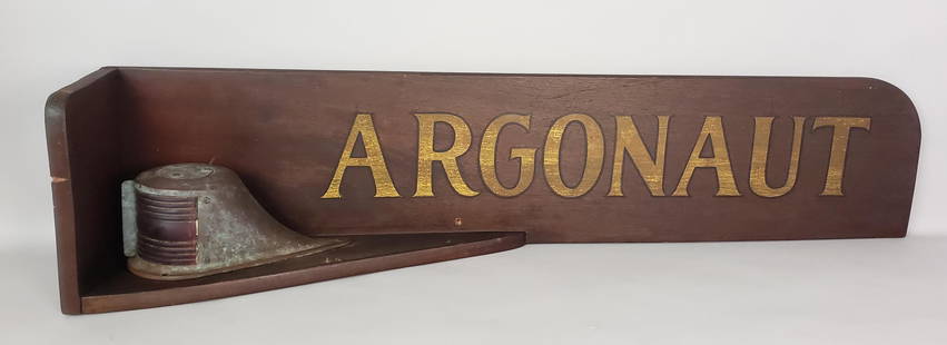 Antique Mahogany Nautical Painted Ship "Argonaut" Name Plaque: Antique Mahogany Nautical Painted Ship "Argonaut" Name Plaque, with attached red glass and bronze port side ship light. Plaques of this type were often used on tugboats and smaller steam yachts in