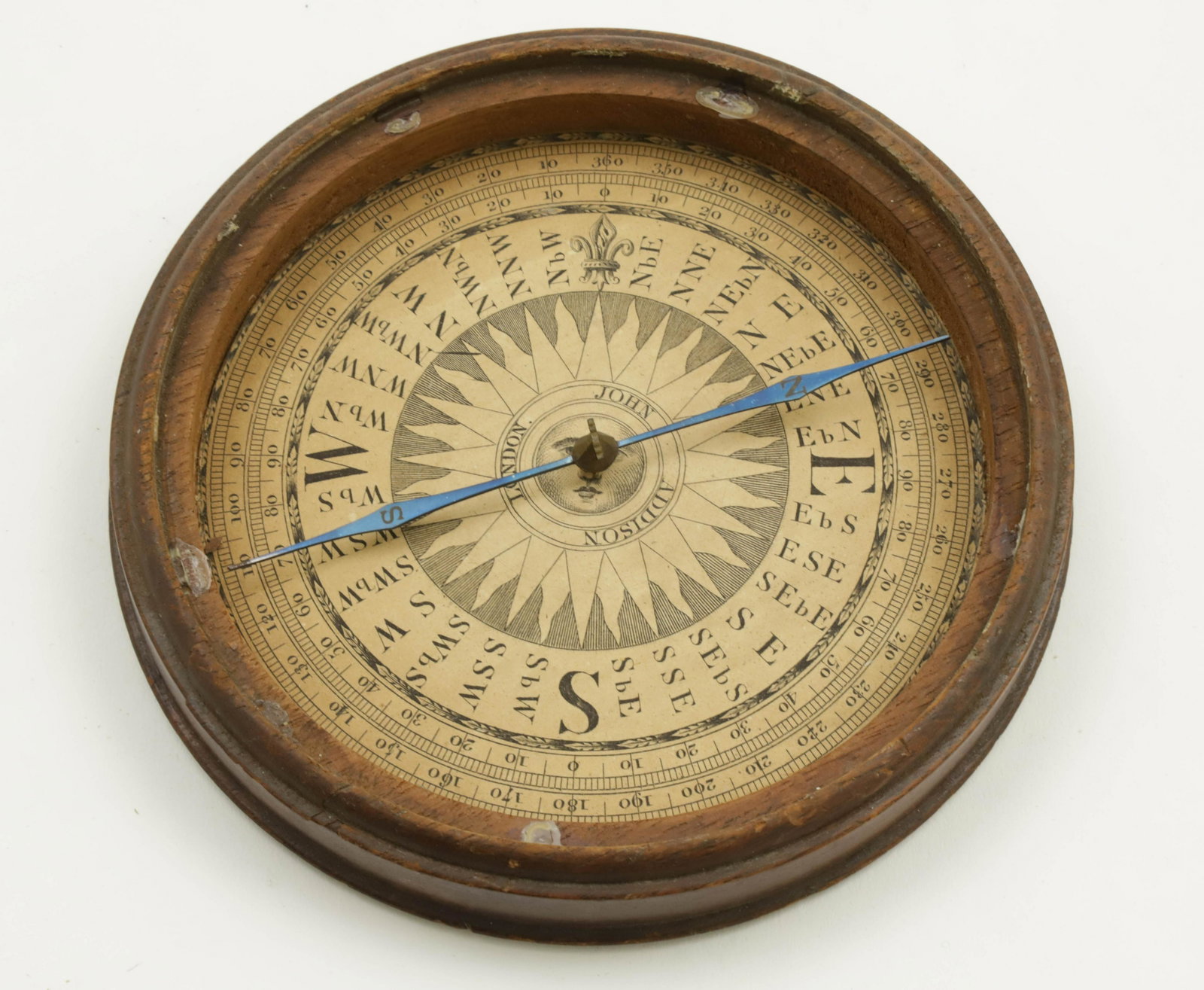 John Addison, London, Mahogany Cased Compass, 19th Century: Mahogany Cased Compass, 19th Century, dial printed by John Addison, London, with magnetized blue steel needle, engraved N and S Height 1 in. Diameter 5.75 in.