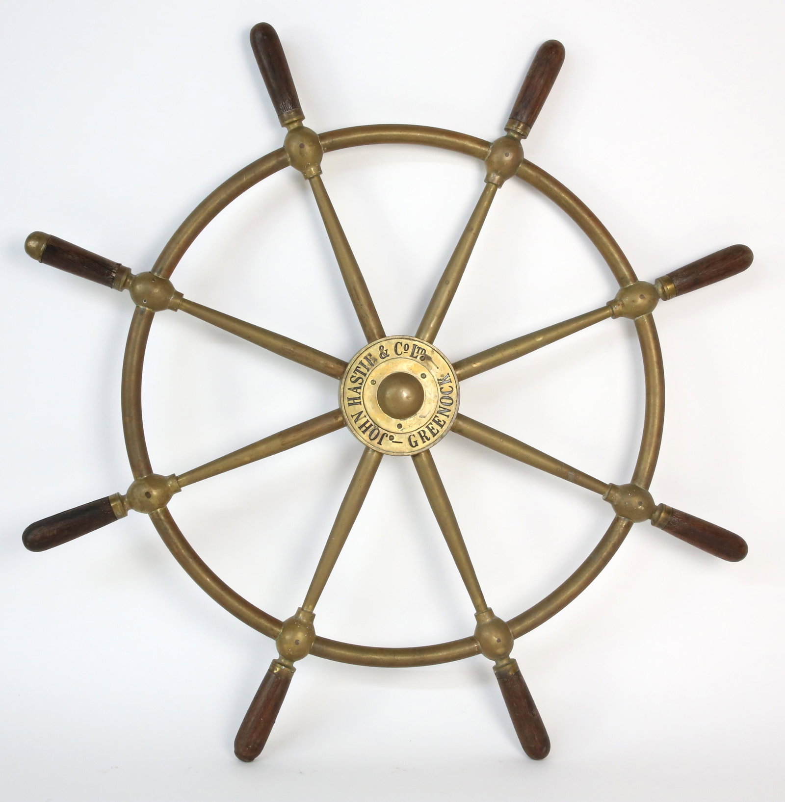 John Hastie and Co. LTD Greenlock Brass Ship's Wheel: John Hastie and Co. LTD Greenlock Brass Ship's Wheel, with signed brass hub and 8 mahogany handles Diameter 29.5 in.