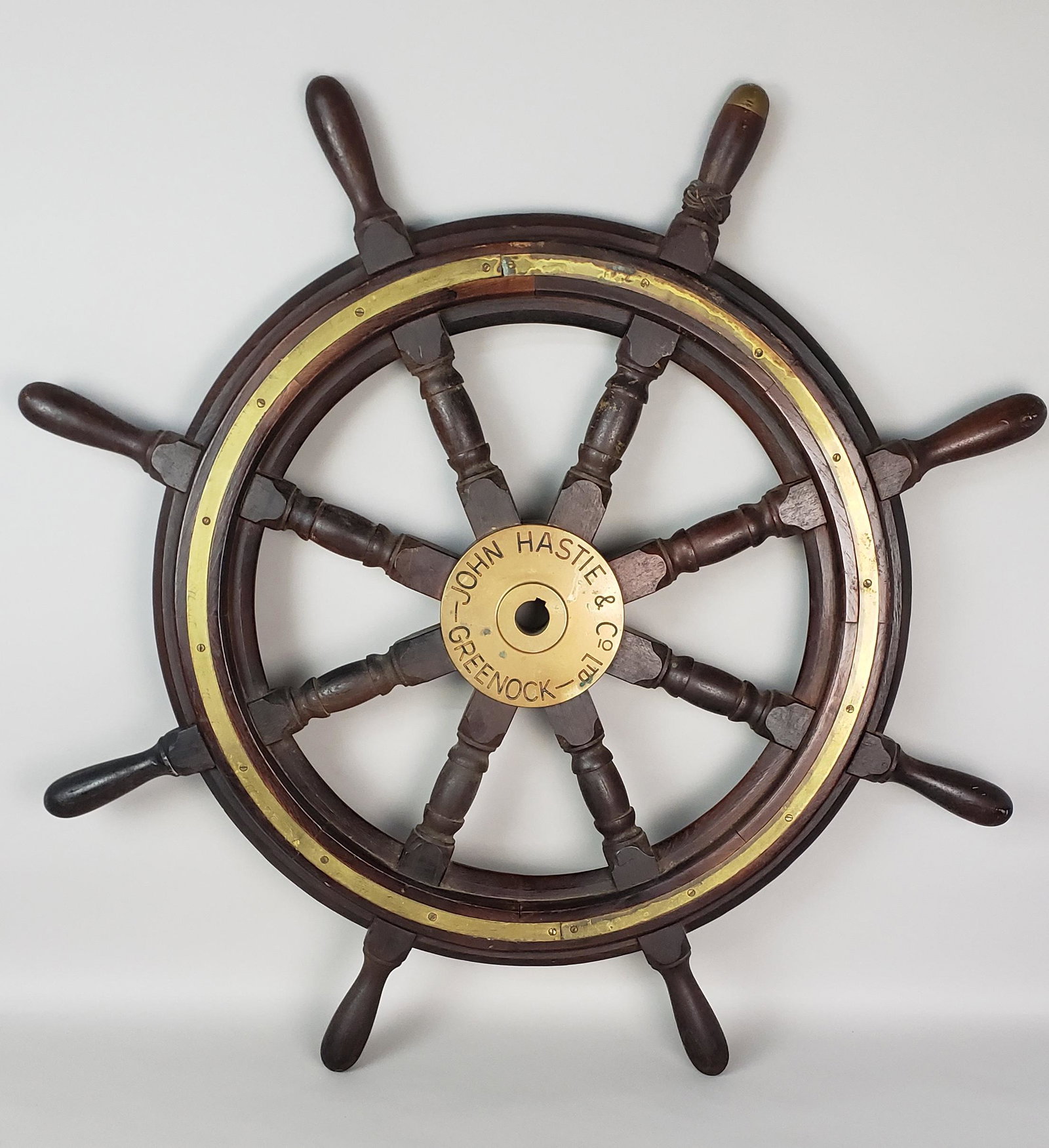 Antique John Hastie Eight-Spoke Captain's Ship Wheel, Greenock, Scotland, 19th Century: Antique John Hastie Eight-Spoke Captain's Ship Wheel, 19th century, Greenock, Scotland, with a brass hub inscribed, "John Hastie & Co Ltd, Greenock", mahogany and brass construction. Diameter 36 i