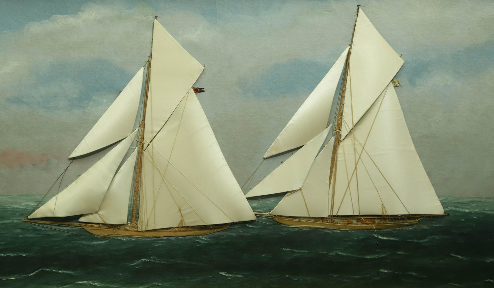 Thomas Willis Silk Embroidery on Painted Canvas "Two Sloops on Choppy Seas": Thomas Willis (New York 1850-1925) Silk Embroidery on Painted Canvas "Two Sloops on Choppy Seas", oil on canvas laid onto board, replaced silk sails, original partial label on reverse 17 in. x 30.75 i