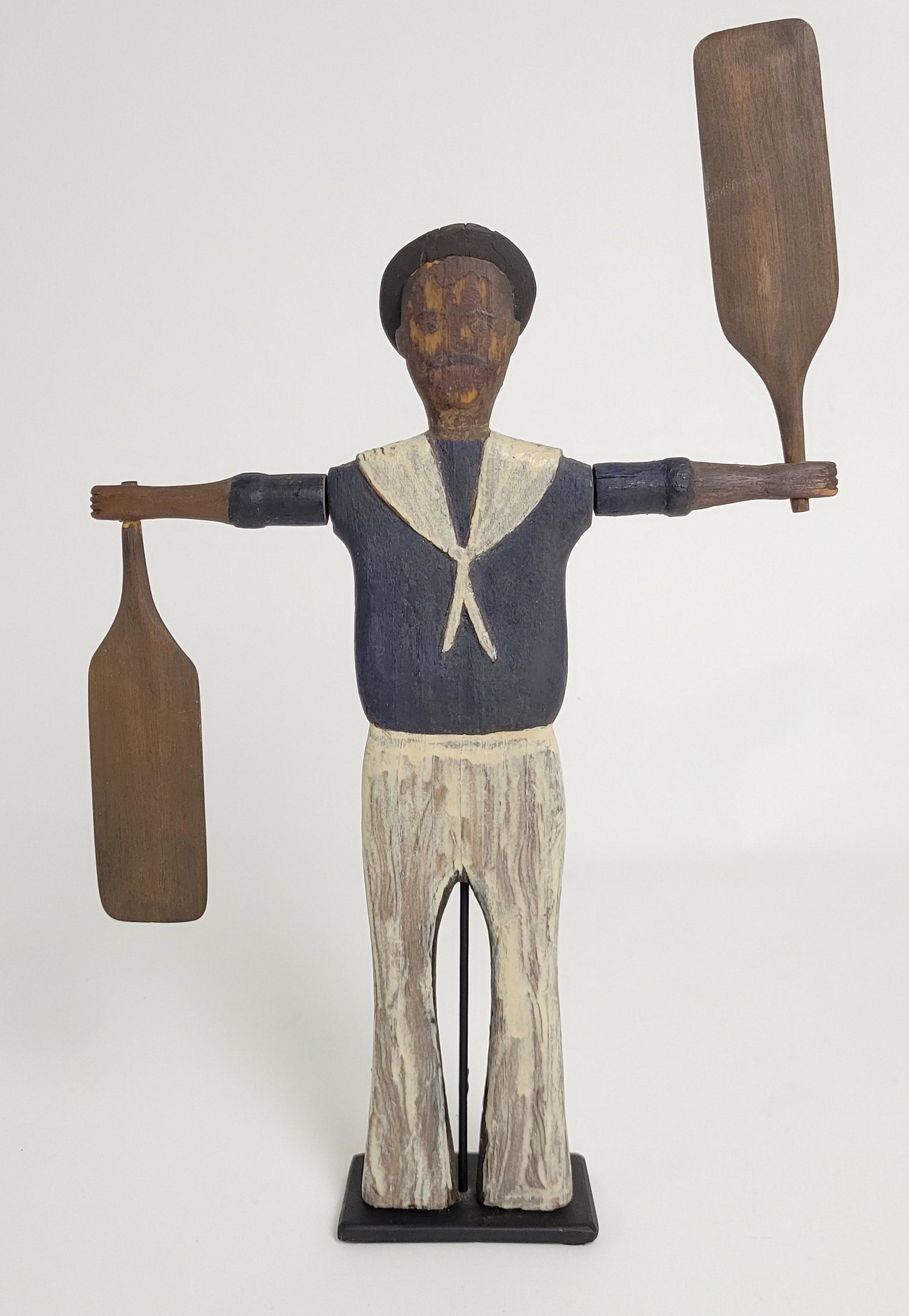 Antique American Folk Art Sailor Boy Whirligig: Antique American Folk Art New England Sailor Boy Whirligig, circa 1900, carved pine with polychrome decoration, old surface with painted face details, New England. Height 13 in. Width 9.5 in.