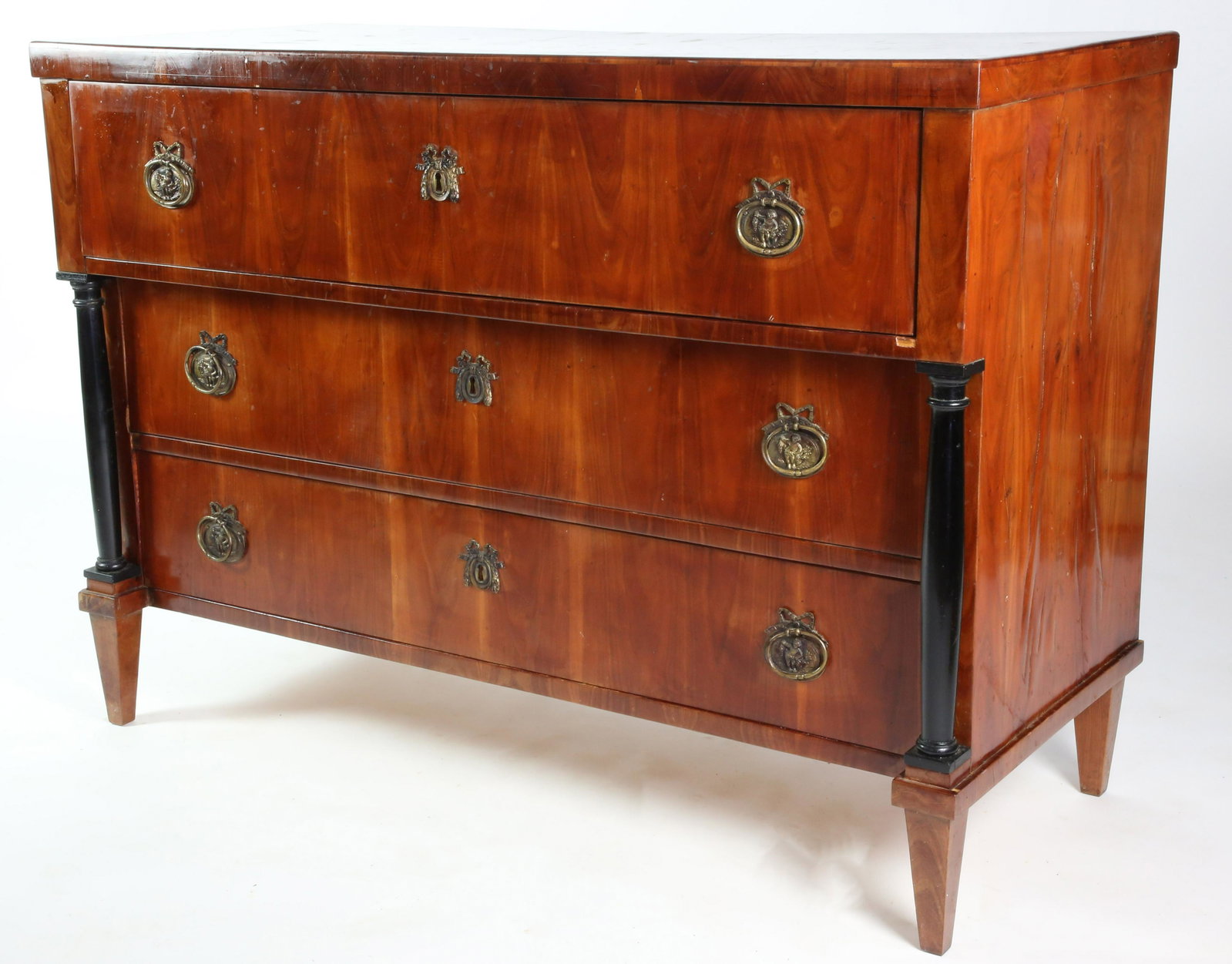Biedermeier Mahogany Chest of Three Drawers, 19th Century: Biedermeier Mahogany Chest of Three Drawers, 19th Century, original brass hardware and keyhole escutcheons, ebonized columns on square tapering legs Height 33 in. Width 46 in. Depth 20 in.