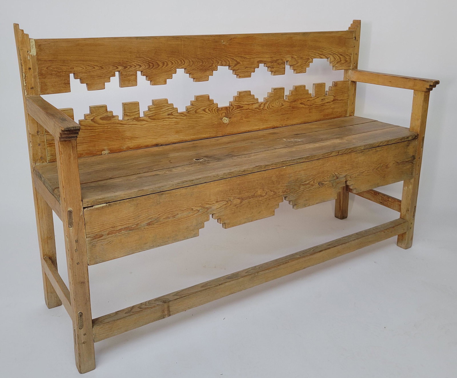 Antique Southwestern Spanish Colonial Cedar Bench: Antique Southwestern Spanish Colonial Cedar Bench, stepped pierced carved back and skirt, pegged and mortised construction. Height 39 in. Width 60 in. Depth 19 in. Seat Height 21.5 in.
