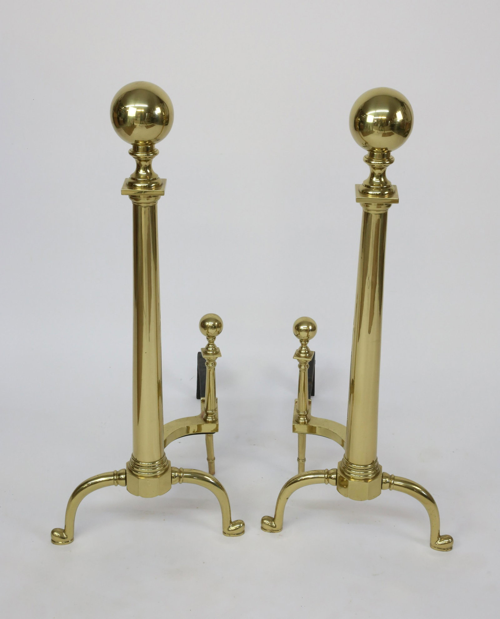 Pair of Tall Ball Top Brass Andirons: Pair of Tall Ball Top Brass Andirons, with matching log stops on arched legs Height 39.5 in. Depth 24 in.