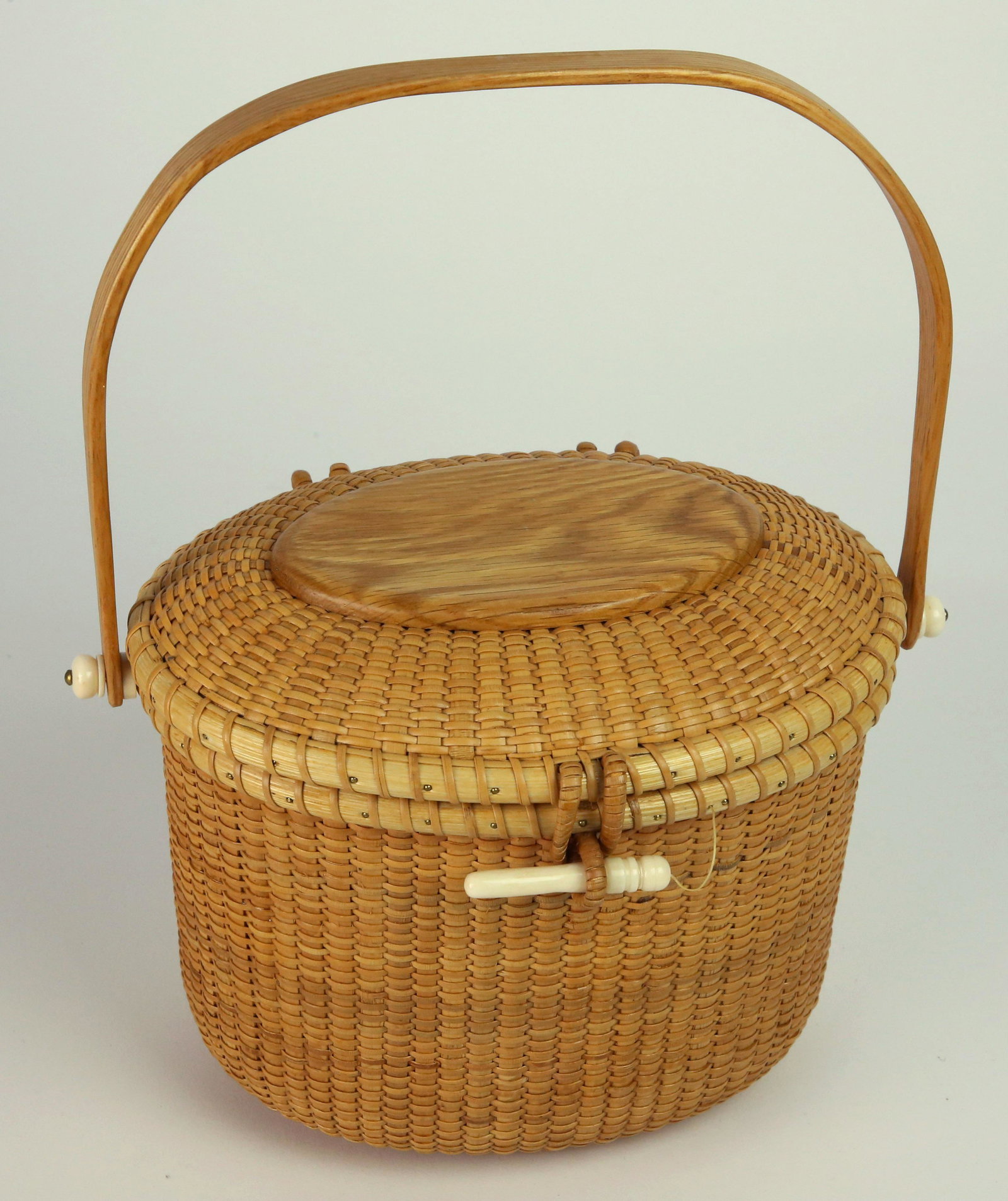 William Reese Nantucket Friendship Basket, circa 1991: William Reese Nantucket Friendship Basket, circa 1991, oval wood plaque top, signed upon the base "Wm Reese, 1991" Height 6.75 in. Width 7.5 in. Depth 6 in.
