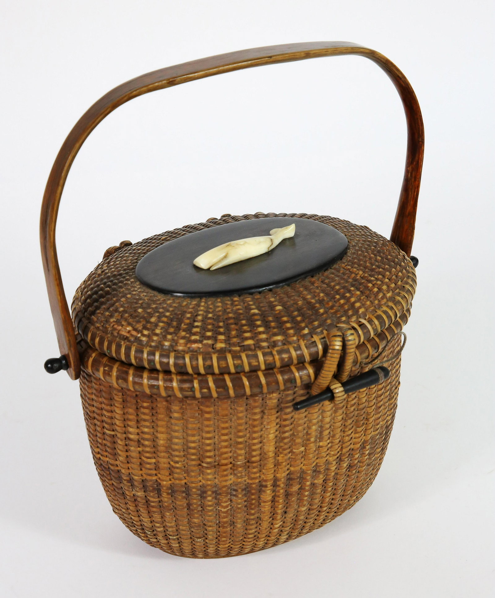 Jose Formoso Reyes Oval Nantucket Friendship Basket: Jose Formoso Reyes (1902-1980) Oval Nantucket Friendship BasketÃ‚ with oval ebony top, peg and knobs, carved whale upon the top, signed upon the base 'Made in Nantucket, Jose Formoso Reyes'with out