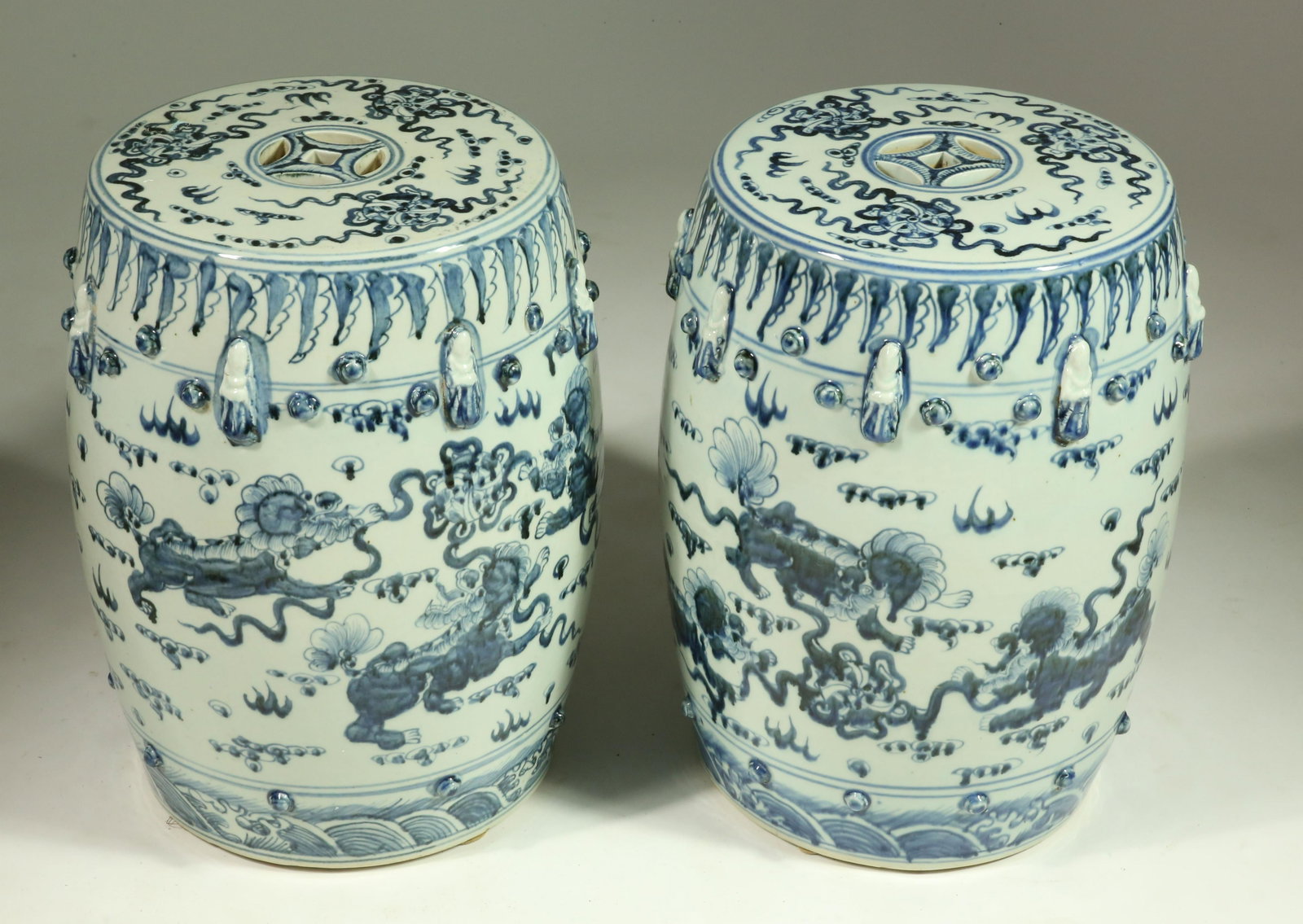 Pair of Chinese Blue and White Porcelain Garden Stools: Pair of Chinese Blue and White Porcelain Garden Stools, decorated with foo lions