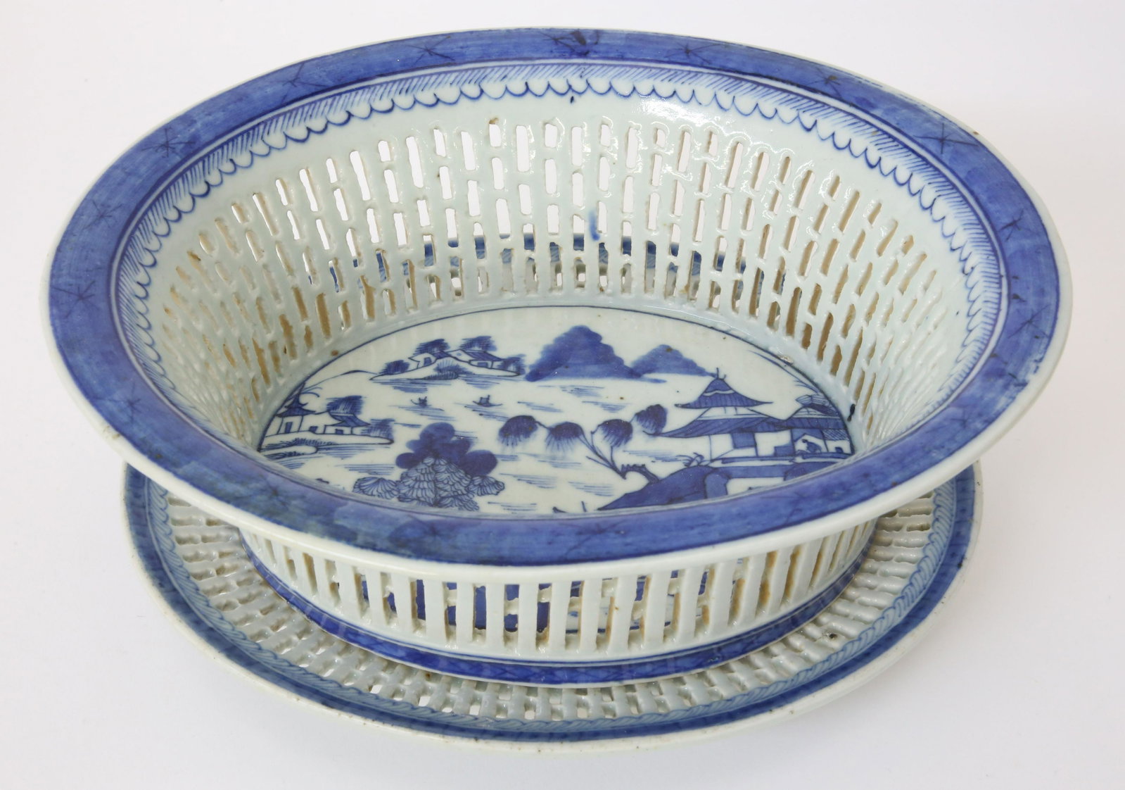 Canton Reticulated Fruit Basket and Stand, late 18th Century: Canton Reticulated Fruit Basket and Stand, late 18th Century, with associated tray and rain and cloud border and Canton River landscape on interior of basket and center of under tray Basket Height 3.2