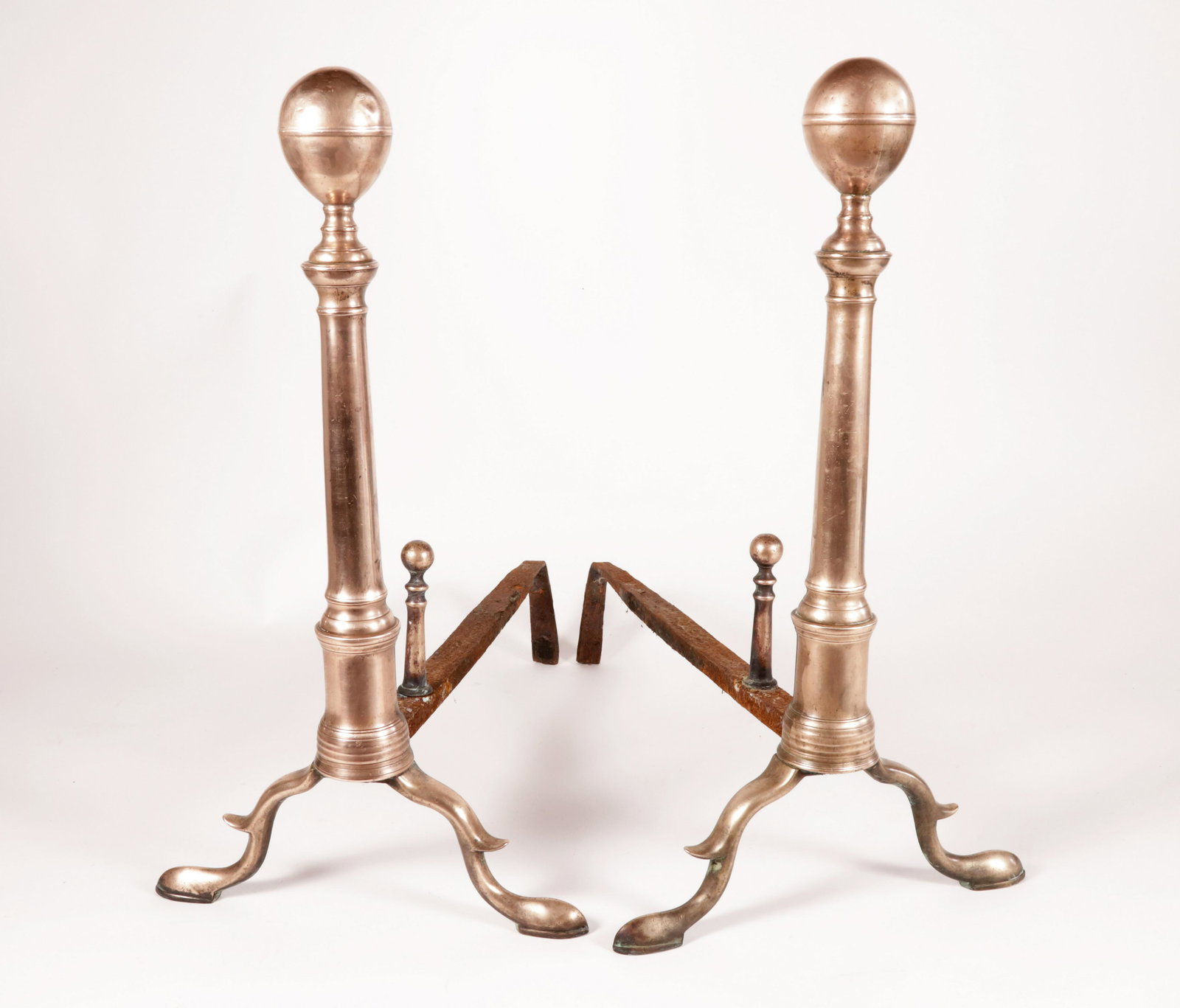 Scarce Pair of Bell Metal Ball Top Andirons, 19th Century: Scarce Pair of Bell Metal Ball Top Andirons, 19th Century, on arched spurred legs ending in slipper feet, with matching log stops Height 20 in. Depth 18 in.