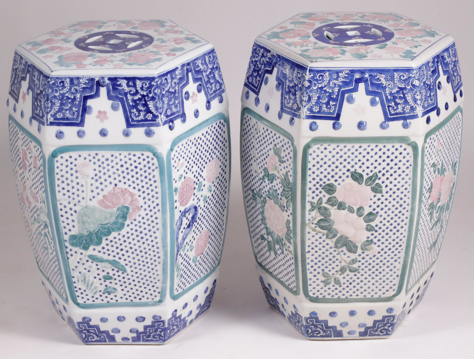 Pair of Antique Chinese Porcelain Garden Stools: Pair of Antique Chinese Porcelain Garden Stools, hexagonal paneled form with raised and painted rose trellis, blue and white fabric panels and studded borders; Note: Repair to one Height 19 in. Diamet
