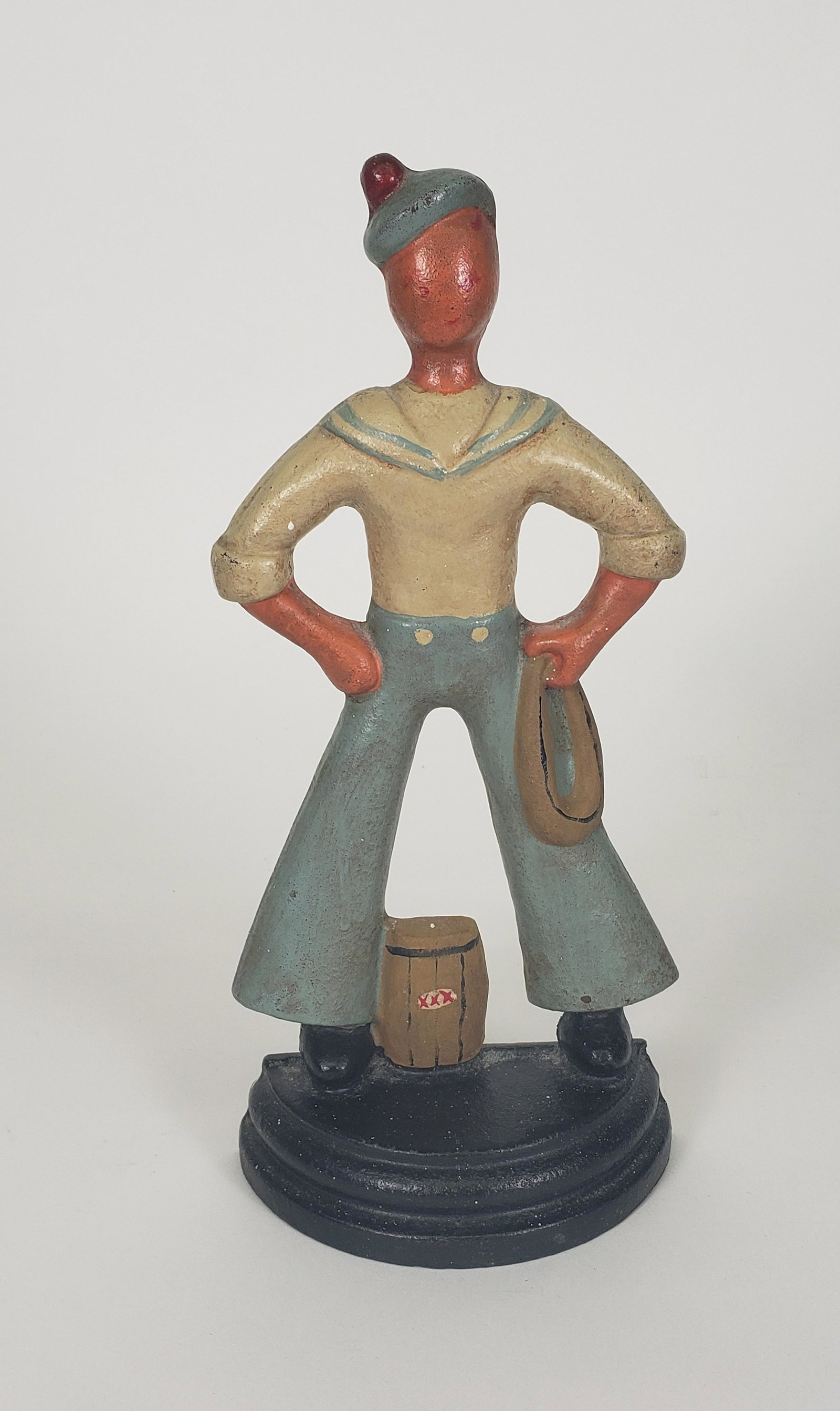 Antique Cast Iron Figural U.S. Naval Sailor Doorstop, circa 1920s: Antique Cast Iron Figural U.S. Naval Sailor Doorstop, circa 1920s, original paint. Height 12.5 in. Width 5.5 in. Depth 2.5 in.