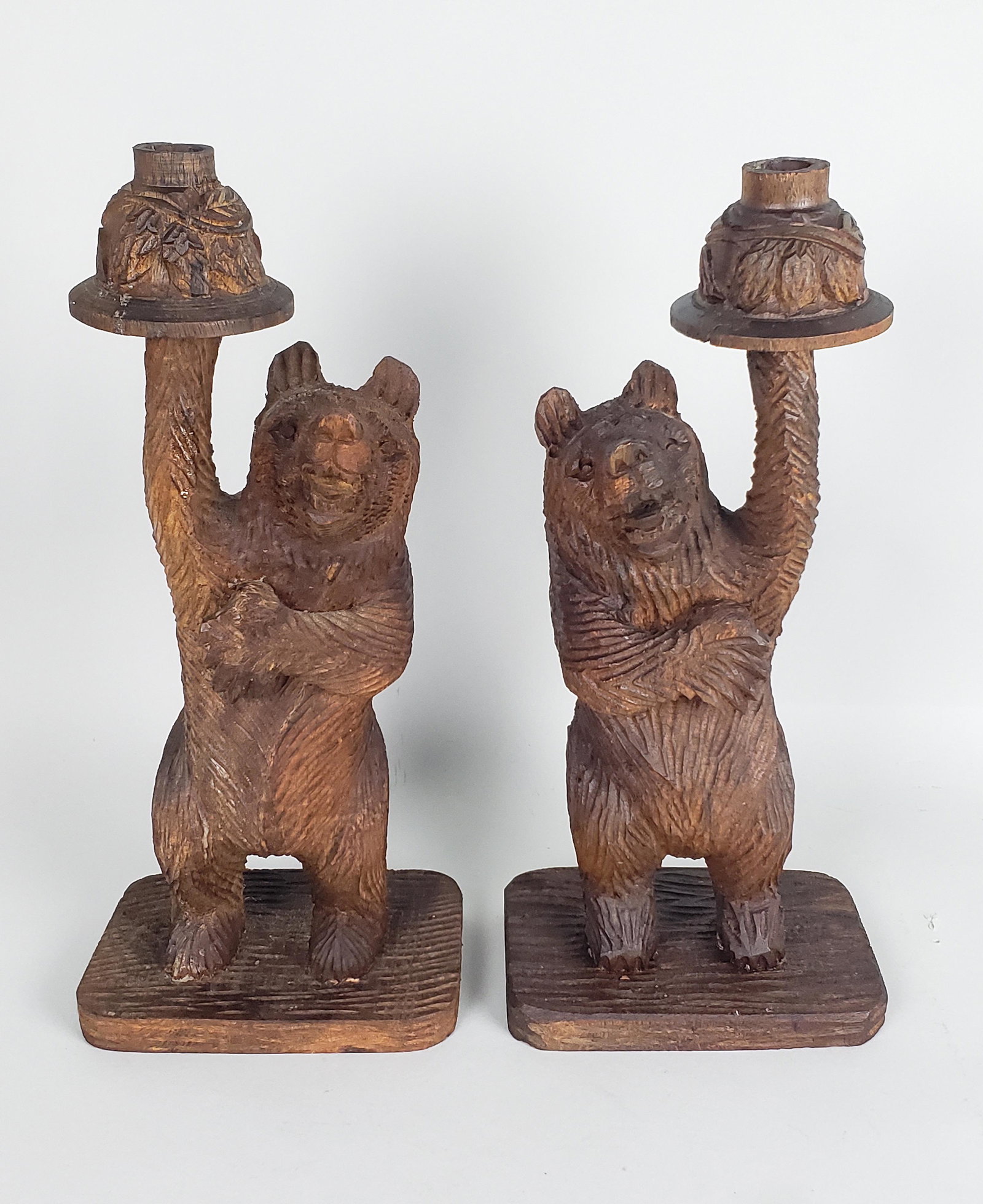 Pair of Antique Black Forest Carved Wooden Figural Bear Candlesticks: Pair of Antique Black Forest Carved Wooden Figural Bear Candlesticks Height 14 in. Width 6.5 in. Depth 4.25 in.