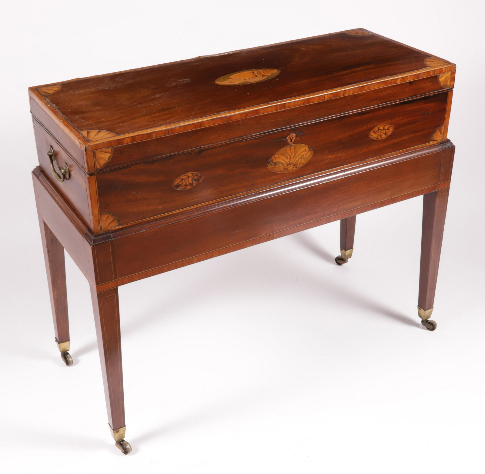 English Inlaid Box on Stand with Brass Handles, 19th Century: English Inlaid Box on Stand with Brass Handles, 19th Century, inlaid with three conch shells, eight quarter fans, fleur de lis and cross banding, on square tapering legs ending in brass casters Height