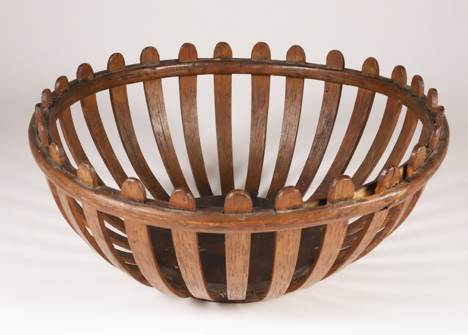 New England Folk Art Open-Work Basket, 19th Century: New England Folk Art Open-Work Basket, 19th Century, with staves protruding above the rim Height 5 in. Diameter 11.5 in.
