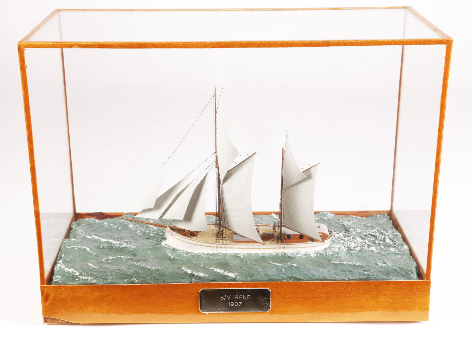 Contemporary Miniature Cased Waterline Model of the S/V Irene, 1907: Contemporary Miniature Cased Waterline Model of the S/V Irene, 1907, built by E. J. Walpole, 1988, mixed media Height 7.75 in. Length 10.5 in. Width 4.75 in. Provenance: The Estate of Stephen Weinroth