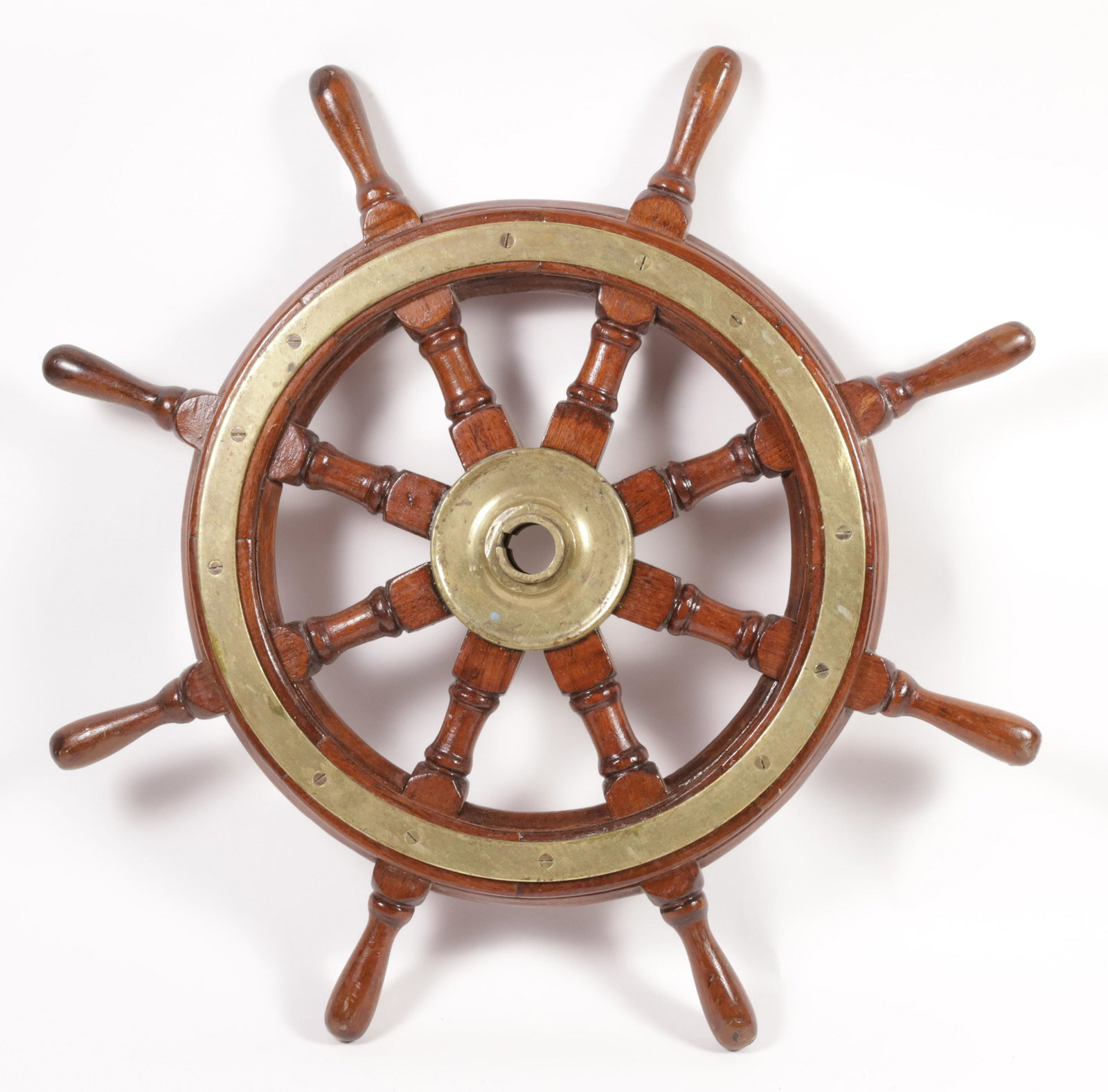 Eight Spoke Mahogany and Brass Captain's Ship Wheel: Eight Spoke Mahogany and Brass Captain's Ship Wheel, with brass hub and brass band around the circumference of the wheel Diameter 32 in.