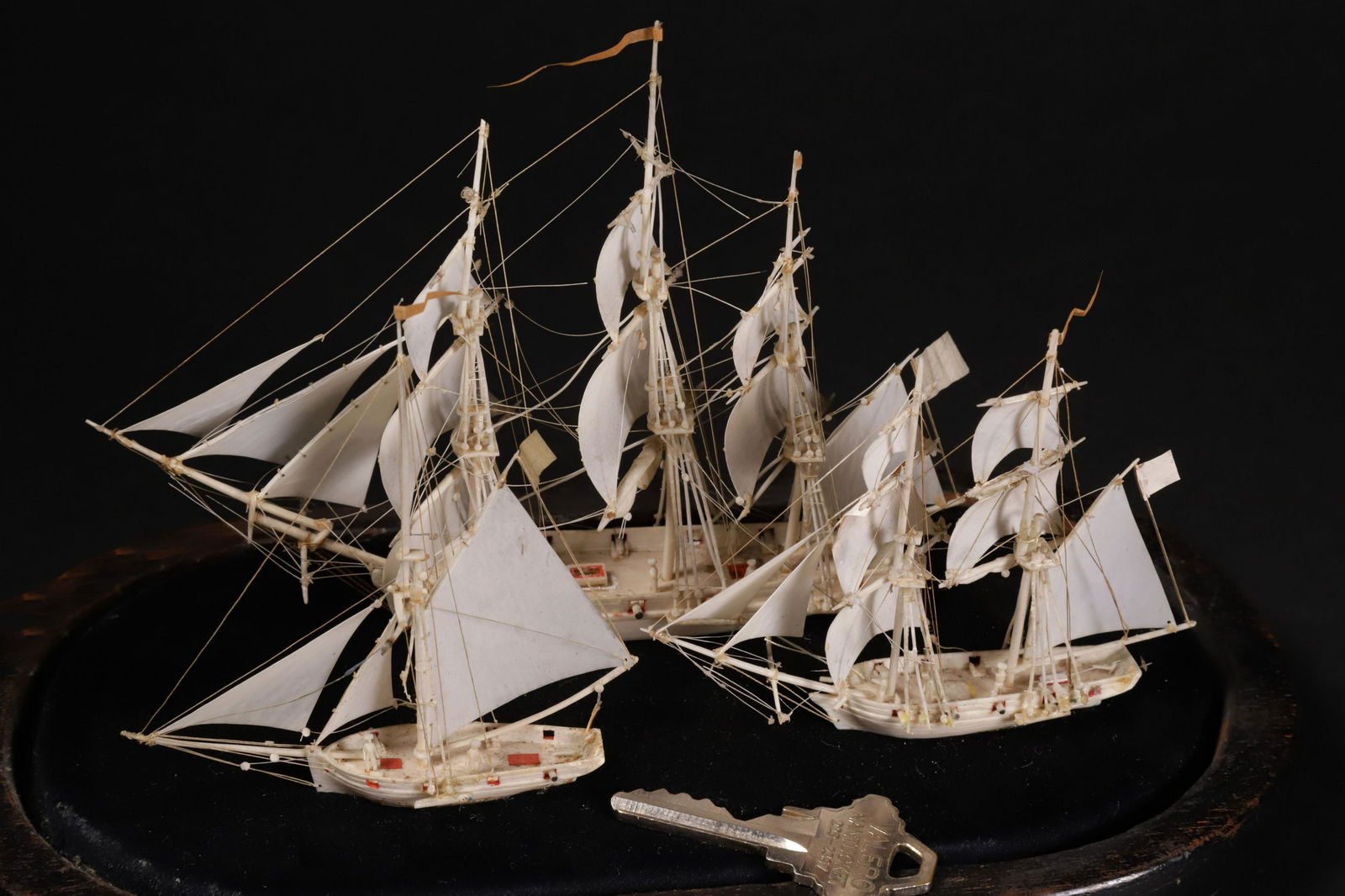 Three Dieppe Miniature Antique Bone Ship Models Under Glass Dome, 19th Century: Three Dieppe Miniature Antique Bone Ship Models Under Glass Dome, 19th Century Largest Ship 4 in. x 6 in. x 2 in. with Dome 8 in. x 9 in. x 5 in. Provenance: The Estate of Stephen Weinroth, Nantucket,