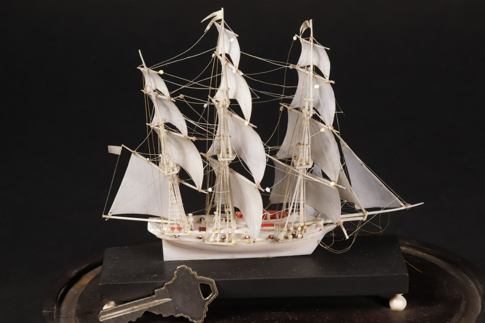 Miniature Antique Dieppe Bone Ship Model Under Glass Dome, 19th Century: Miniature Antique Dieppe Bone Ship Model Under Glass Dome, 19th Century Height 4.5 in. Length 5.75 in. Width 1.5 in. With dome 9 in. x 8 in. x 4 in. Provenance: The Estate of Stephen Weinroth, Nantuck