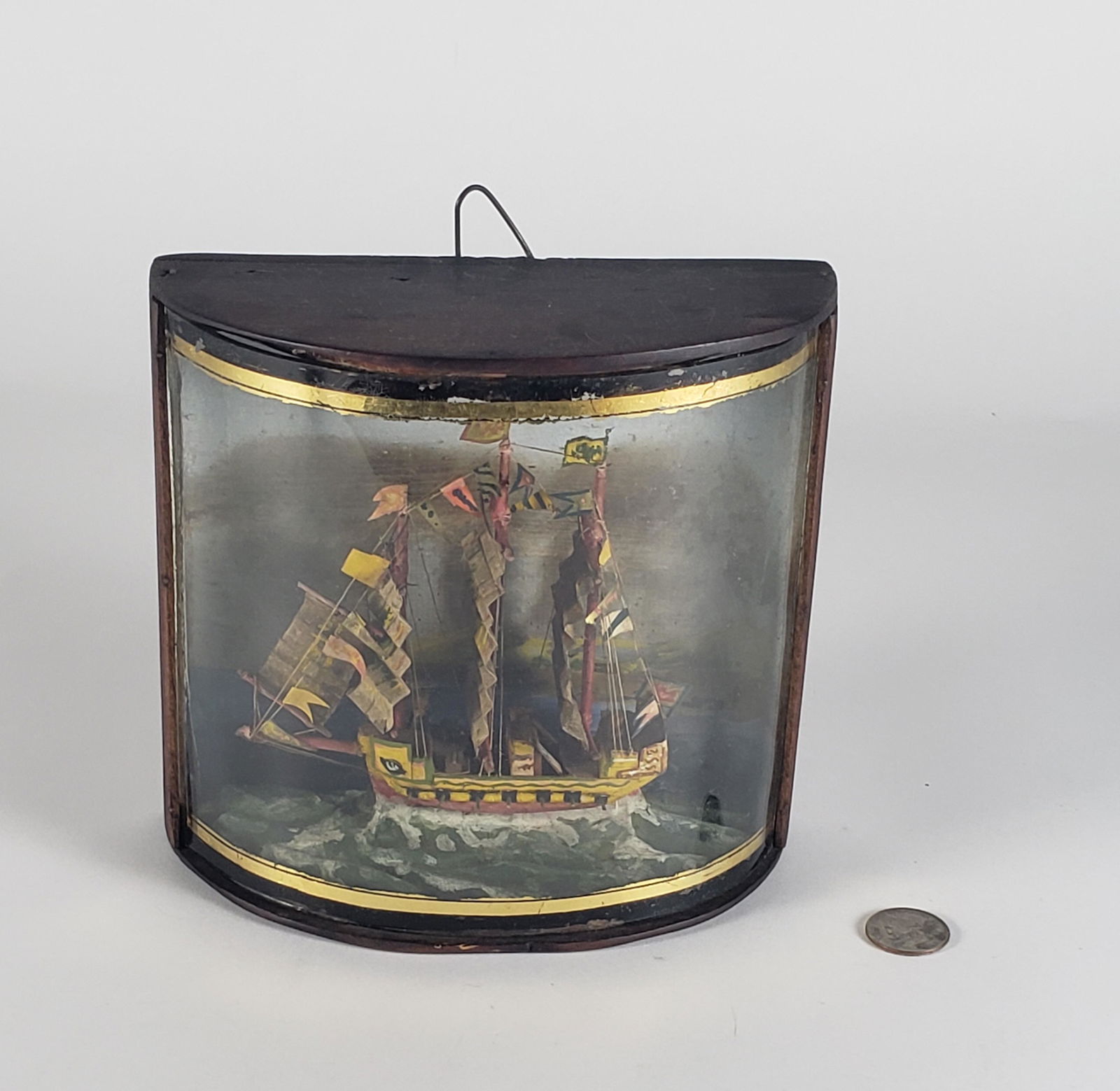 Antique Folk Art Miniature Naval Ship Bow Front Shadowbox, 19th century: Antique Folk Art Miniature Naval Ship Bow Front Shadowbox, 19th century, depicting a Galleon man o' war clipper ship in the open seas, paint decoration.
