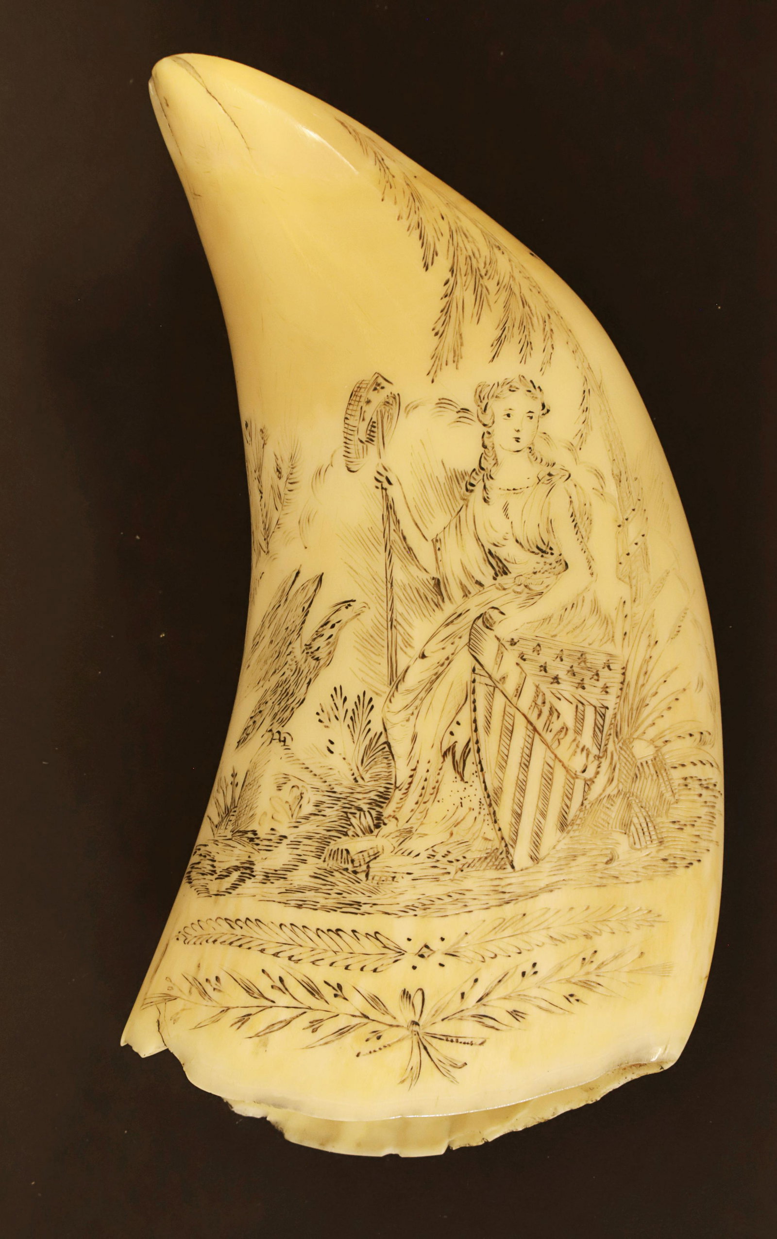 Lady Liberty Antique Scrimshaw Sperm Whale Tooth, 19th Century: Lady Liberty Antique Scrimshaw Sperm Whale Tooth, 19th Century, engraved on both sides: Lady Liberty and whaling scene and eagle with four American flags verso Height 5.5 in. Width 3 in.