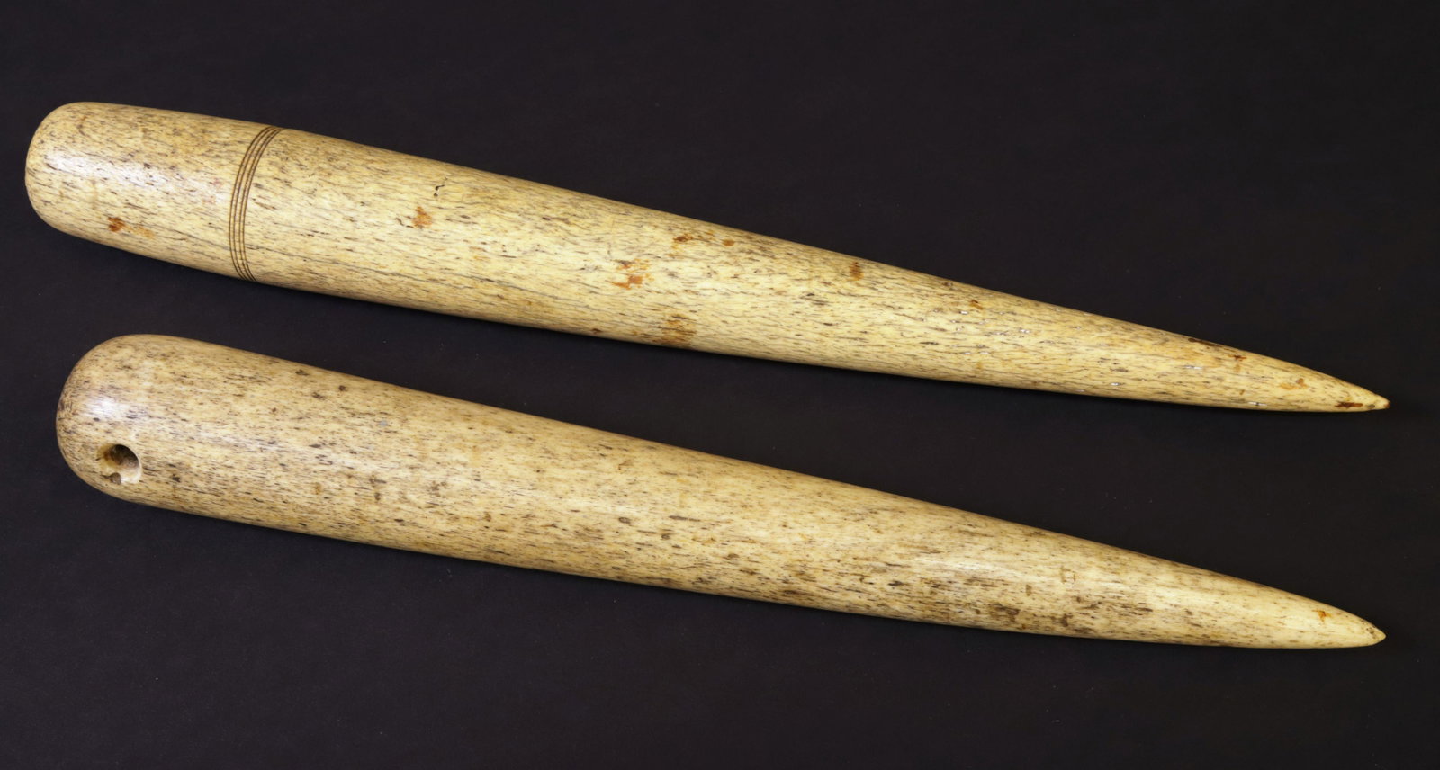 Two Whaleman Made Antique Whalebone Fids, circa 1850s: Two Whaleman Made Antique Whalebone Fids, circa 1850s, the first with four scribe lines, the second with drilled hole to receive a rope Lengths 14 in. and 12.25 in.