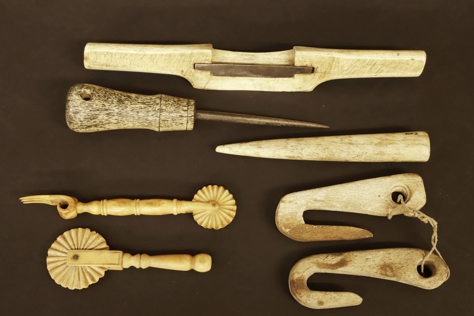 Miscellaneous Group of Antique Whalebone Pieces, 19th Century: Miscellaneous Group of Antique Whalebone Pieces, 19th Century, consisting of a fid, pull-shave, pair love hooks, and two pie crimpers